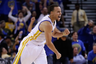 OAKLAND, CA - NOVEMBER 01:  Stephen Curry #30 of the Golden State Warriors reacts after he threw a long down court assist to Klay Thompson #11 who made a three-point basket against the Los Angeles Lakers at ORACLE Arena on November 1, 2014 in Oakland, Cal