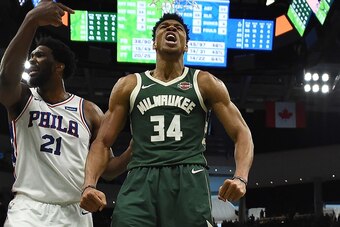 MILWAUKEE, WISCONSIN - MARCH 17:  Giannis Antetokounmpo #34 of the Milwaukee Bucks reacts to a dunk over Ben Simmons #25 of the Philadelphia 76ers during the second half of a game at Fiserv Forum on March 17, 2019 in Milwaukee, Wisconsin. NOTE TO USER: Us