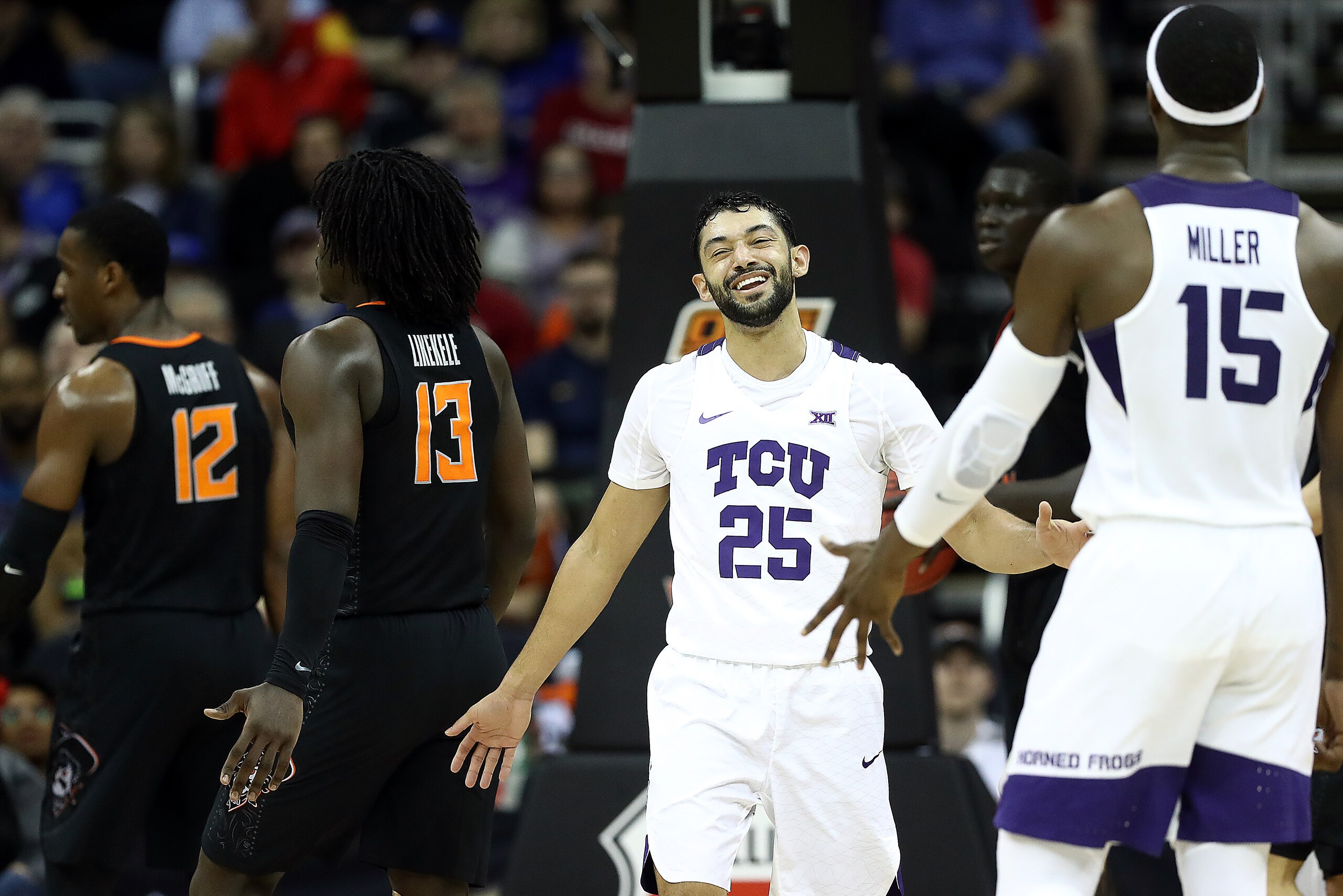 KANSAS CITY, MISSOURI - MARCH 13:  Alex Robinson #25 of the TCU Horned Frogs smiles after drawing a foul during the first round game of the Big 12 Basketball Tournament against the Oklahoma State Cowboys at the Sprint Center on March 13, 2019 in Kansas Ci