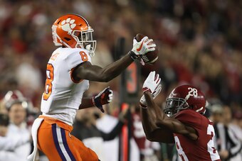 SANTA CLARA, CA - JANUARY 07:  Justyn Ross #8 of the Clemson Tigers makes a catch against Josh Jobe #28 of the Alabama Crimson Tide during the third quarter in the CFP National Championship presented by AT&T at Levi's Stadium on January 7, 2019 in Santa C