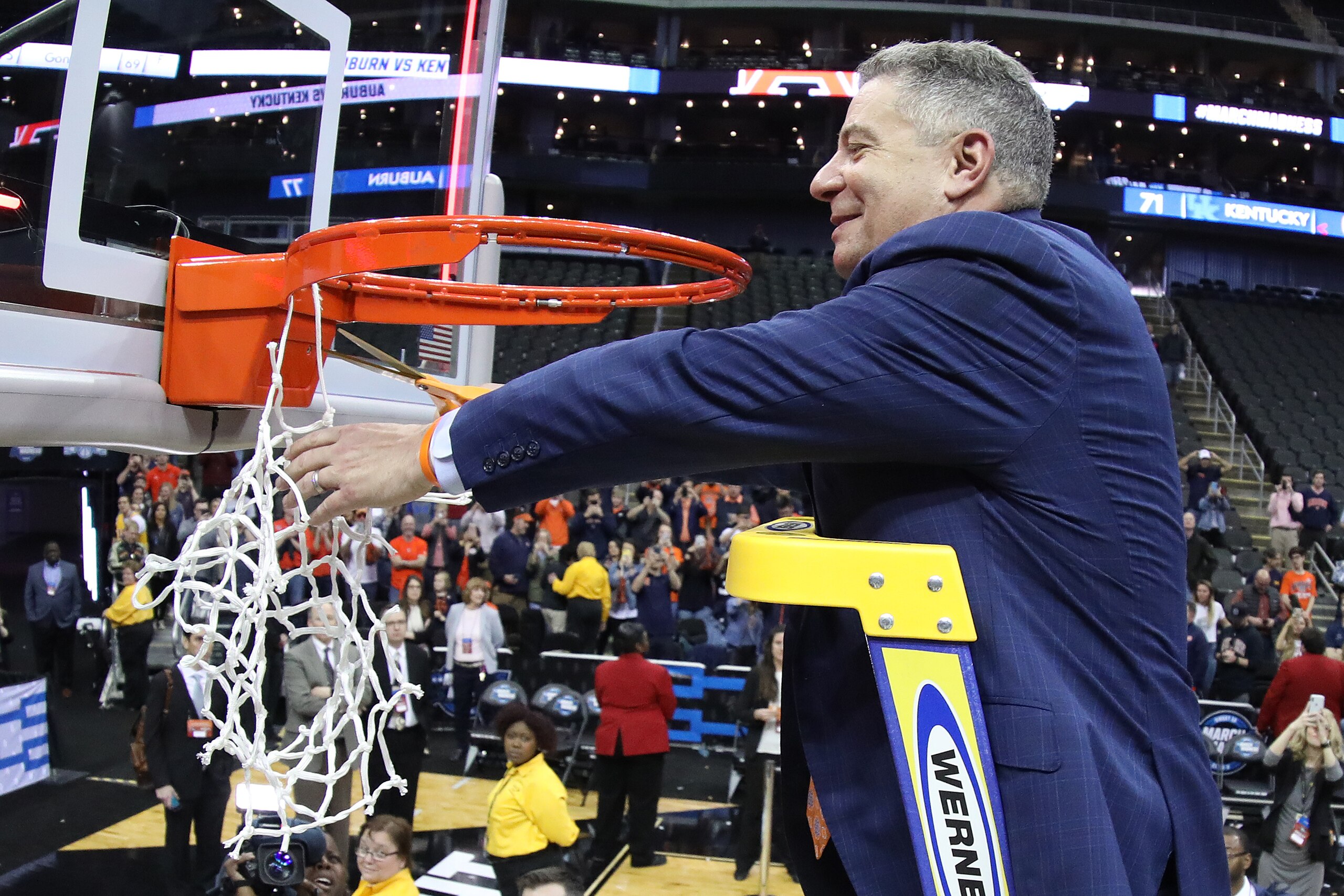 KANSAS CITY, MISSOURI - MARCH 31: Head coach Bruce Pearl of the Auburn Tigers celebrates by cutting down the nets after their 77-71 win over the Kentucky Wildcats in the 2019 NCAA Basketball Tournament Midwest Regional at Sprint Center on March 31, 2019 i
