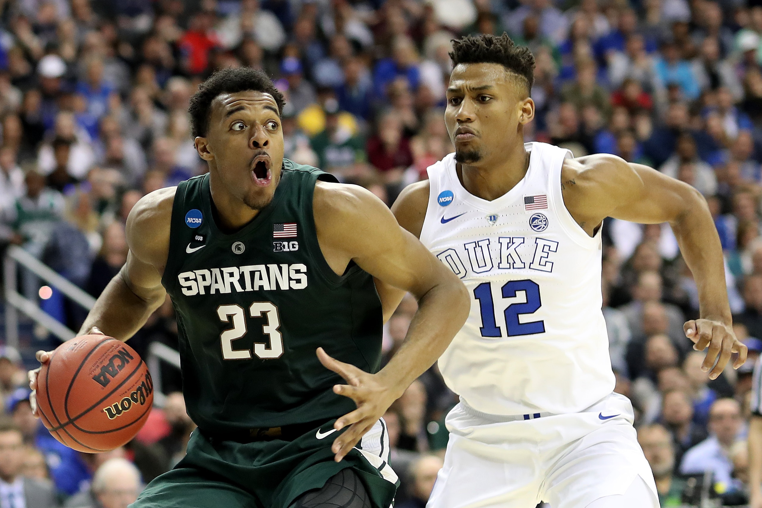 WASHINGTON, DC - MARCH 31: Xavier Tillman #23 of the Michigan State Spartans is defended by Javin DeLaurier #12 of the Duke Blue Devils during the second half in the East Regional game of the 2019 NCAA Men's Basketball Tournament at Capital One Arena on M