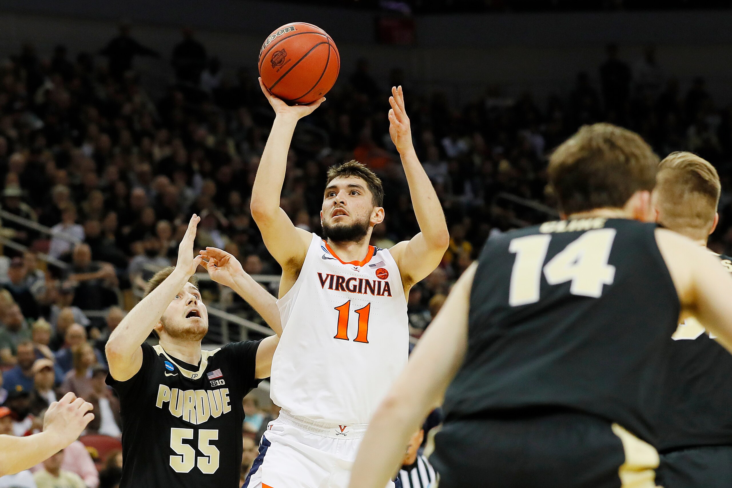 LOUISVILLE, KENTUCKY - MARCH 30:  Ty Jerome #11 of the Virginia Cavaliers shoots against the Purdue Boilermakers during the first half of the 2019 NCAA Men's Basketball Tournament South Regional at KFC YUM! Center on March 30, 2019 in Louisville, Kentucky