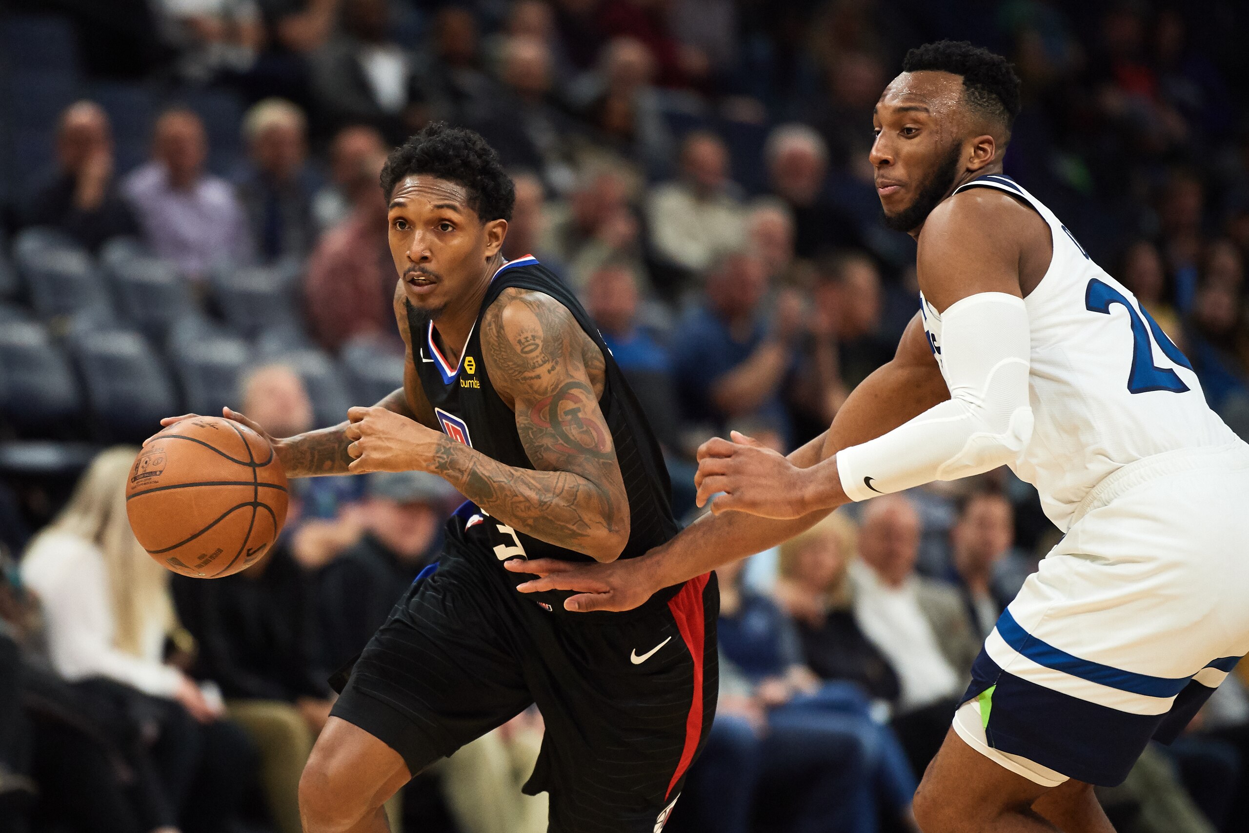 MINNEAPOLIS, MN - MARCH 26: Lou Williams #23 of the LA Clippers drives to the basket against Josh Okogie #20 of the Minnesota Timberwolves during the game on March 26, 2019 at the Target Center in Minneapolis, Minnesota. NOTE TO USER: User expressly ackno