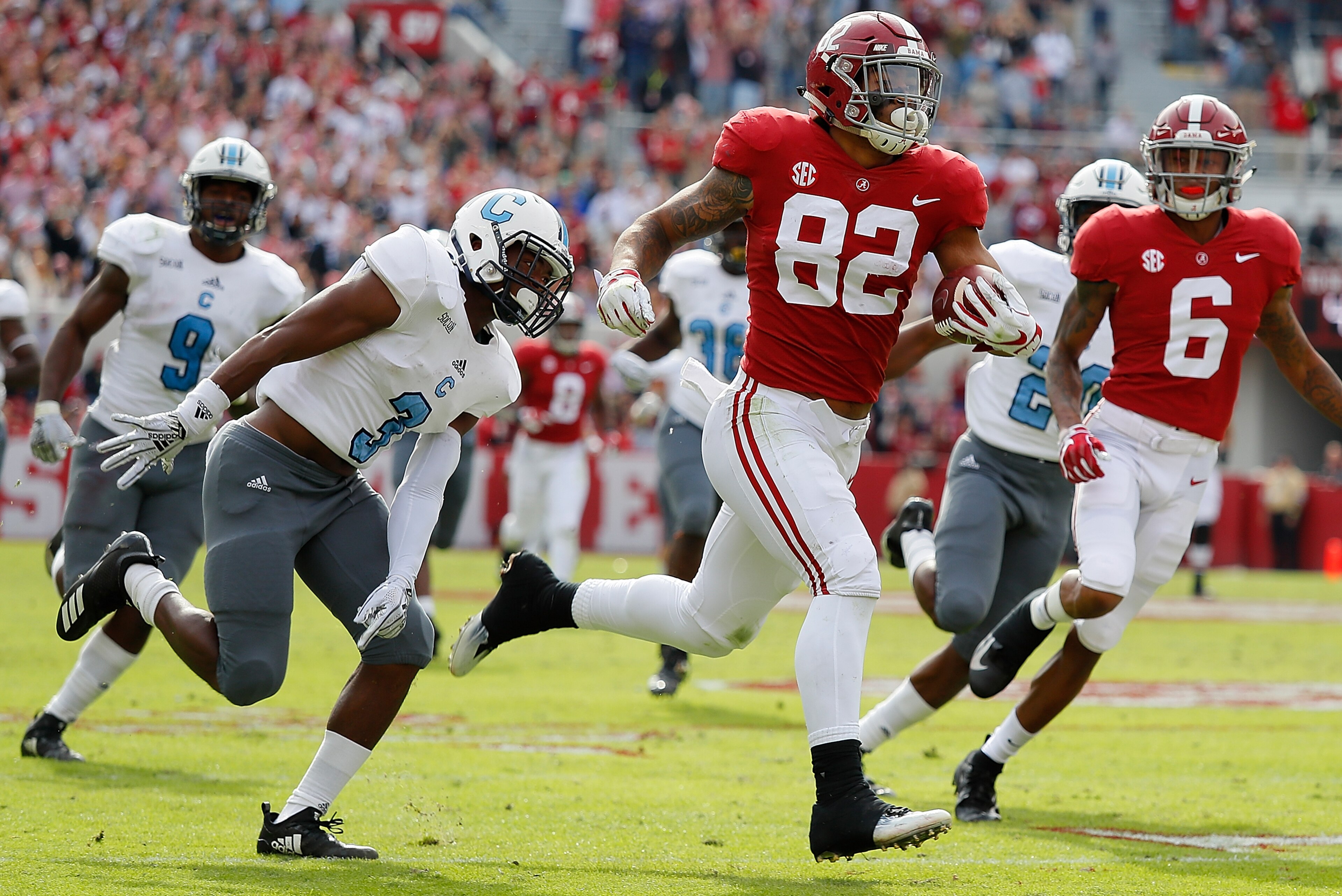 TUSCALOOSA, AL - NOVEMBER 17: Irv Smith Jr. #82 of the Alabama Crimson Tide breaks away with a reception on the way to a touchdown against Joshua Bowers #3 of the Citadel Bulldogs at Bryant-Denny Stadium on November 17, 2018 in Tuscaloosa, Alabama. (Pho TUSCALOOSA, AL - NOVEMBER 17: Irv Smith Jr. #82 of the Alabama Crimson Tide breaks away with a reception on the way to a touchdown against Joshua Bowers #3 of the Citadel Bulldogs at Bryant-Denny Stadium on November 17, 2018 in Tuscaloosa, Alabama. (Pho