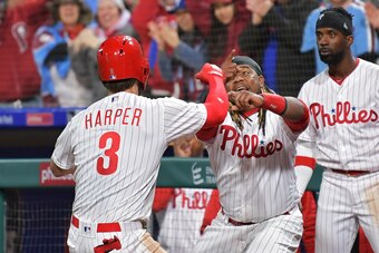 PHILADELPHIA, PA - MARCH 31: Bryce Harper #3 and Maikel Franco #7 of the Philadelphia Phillies celebrate Harpers home run in the seventh inning against the Atlanta Braves at Citizens Bank Park on March 31, 2019 in Philadelphia, Pennsylvania. (Photo by Dre