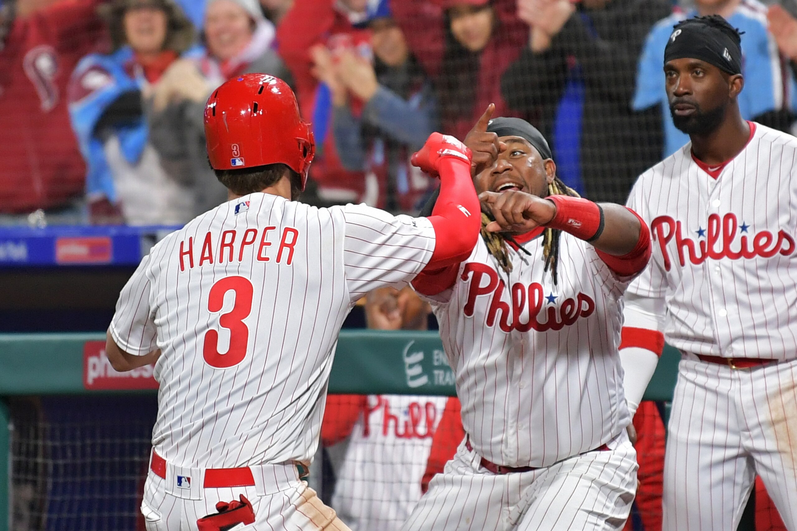 PHILADELPHIA, PA - MARCH 31: Bryce Harper #3 and Maikel Franco #7 of the Philadelphia Phillies celebrate Harpers home run in the seventh inning against the Atlanta Braves at Citizens Bank Park on March 31, 2019 in Philadelphia, Pennsylvania. (Photo by Dre