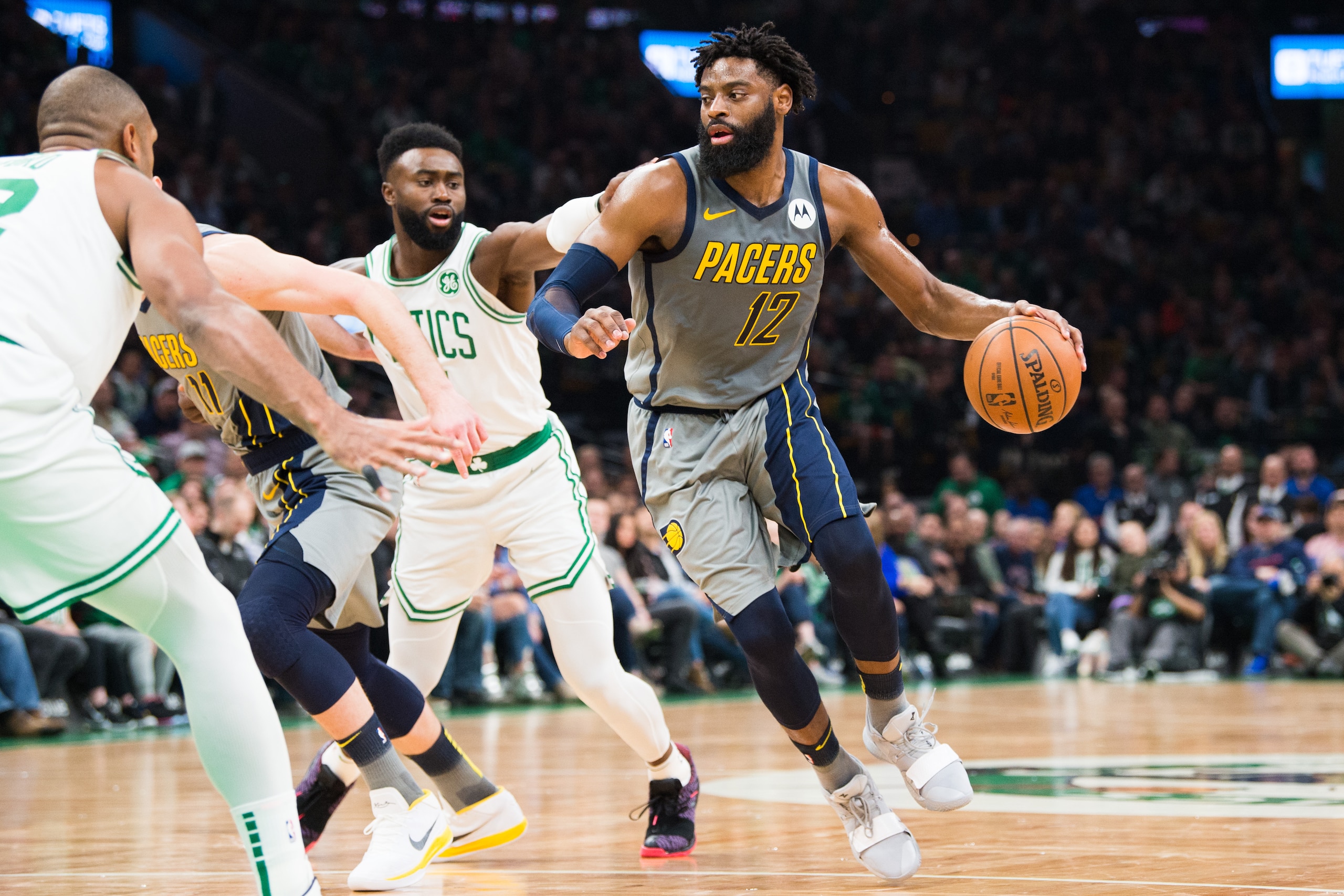 BOSTON, MA - MARCH 29: Tyreke Evans #12 of the Indiana Pacers dribbles past Jaylen Brown #7 of the Boston Celtics at TD Garden on March 29, 2019 in Boston, Massachusetts. NOTE TO USER: User expressly acknowledges and agrees that, by downloading and or usi