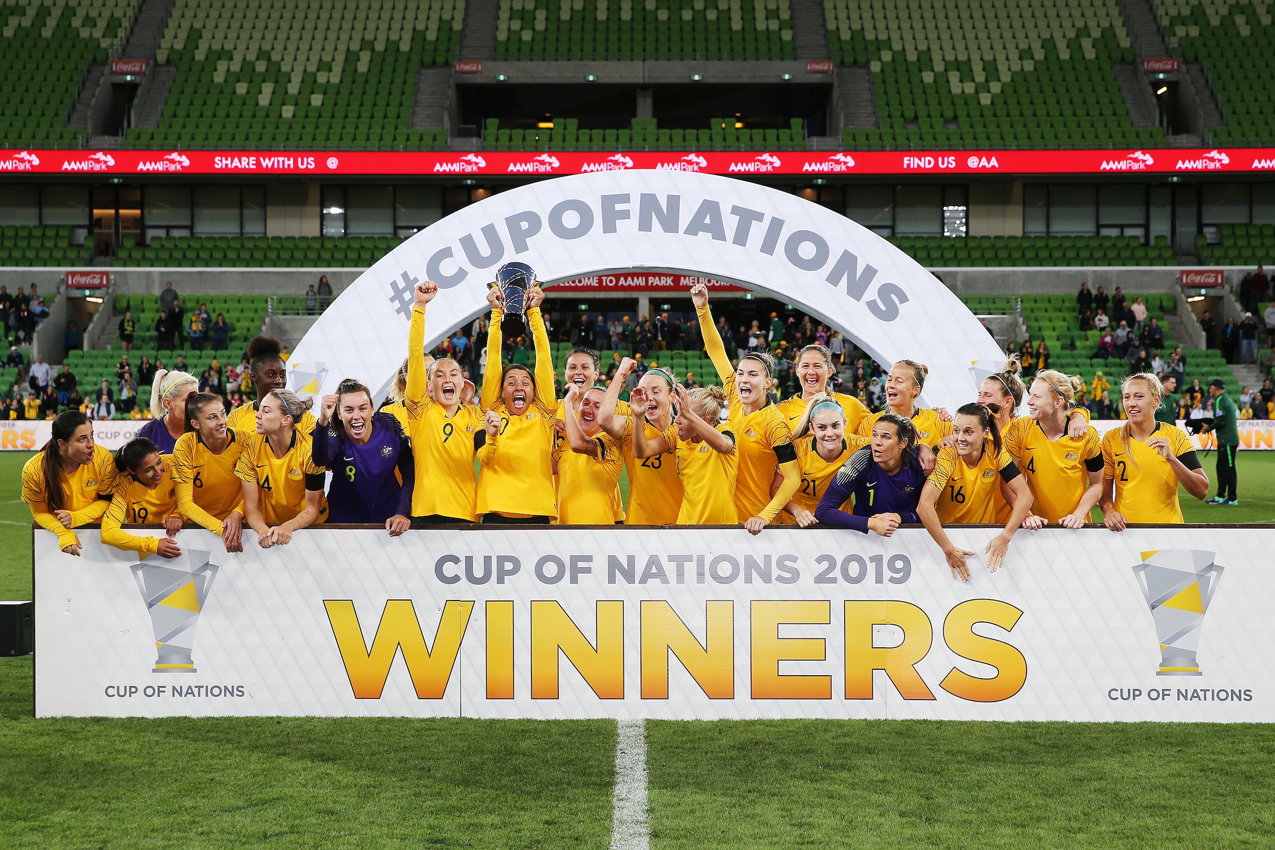 MELBOURNE, AUSTRALIA - MARCH 06: Sam Kerr of the Matildas lifts up the trophy and celebrates the win with teammates during the Cup of Nations match between Australia and Argentina at AAMI Park on March 06, 2019 in Melbourne, Australia. (Photo by Michael D