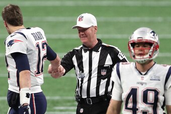 ATLANTA, GEORGIA - FEBRUARY 03: Tom Brady #12 of the New England Patriots greets referee John Parry #132 prior to Super Bowl LIII against Los Angeles Rams at Mercedes-Benz Stadium on February 03, 2019 in Atlanta, Georgia. (Photo by Patrick Smith/Getty Ima