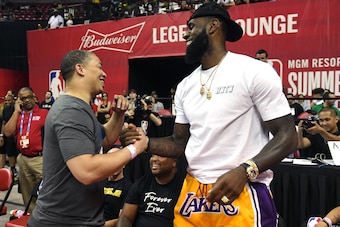 LAS VEGAS, NV - JULY 15:  Head coach Tyronn Lue (L) of the Cleveland Cavaliers greets LeBron James of the Los Angeles Lakers after a quarterfinal game of the 2018 NBA Summer League between the Lakers and the Detroit Pistons at the Thomas & Mack Center on 