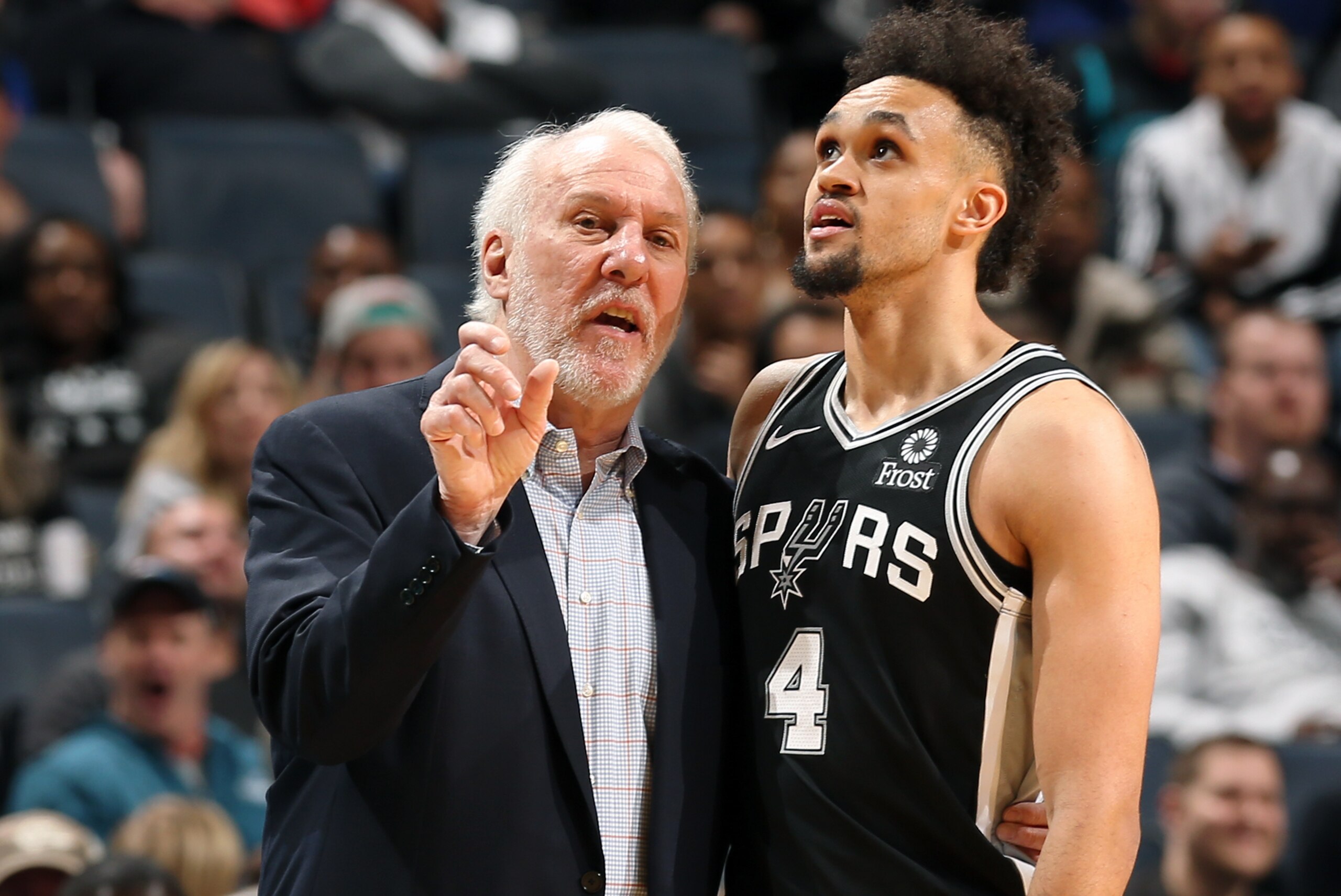 CHARLOTTE, NC - MARCH 26: Head Coach Gregg Popovich and Derrick White #4 of the San Antonio Spurs talk during the game against the Charlotte Hornets on March 26, 2019 at the Spectrum Center in Charlotte, North Carolina. NOTE TO USER: User expressly acknow