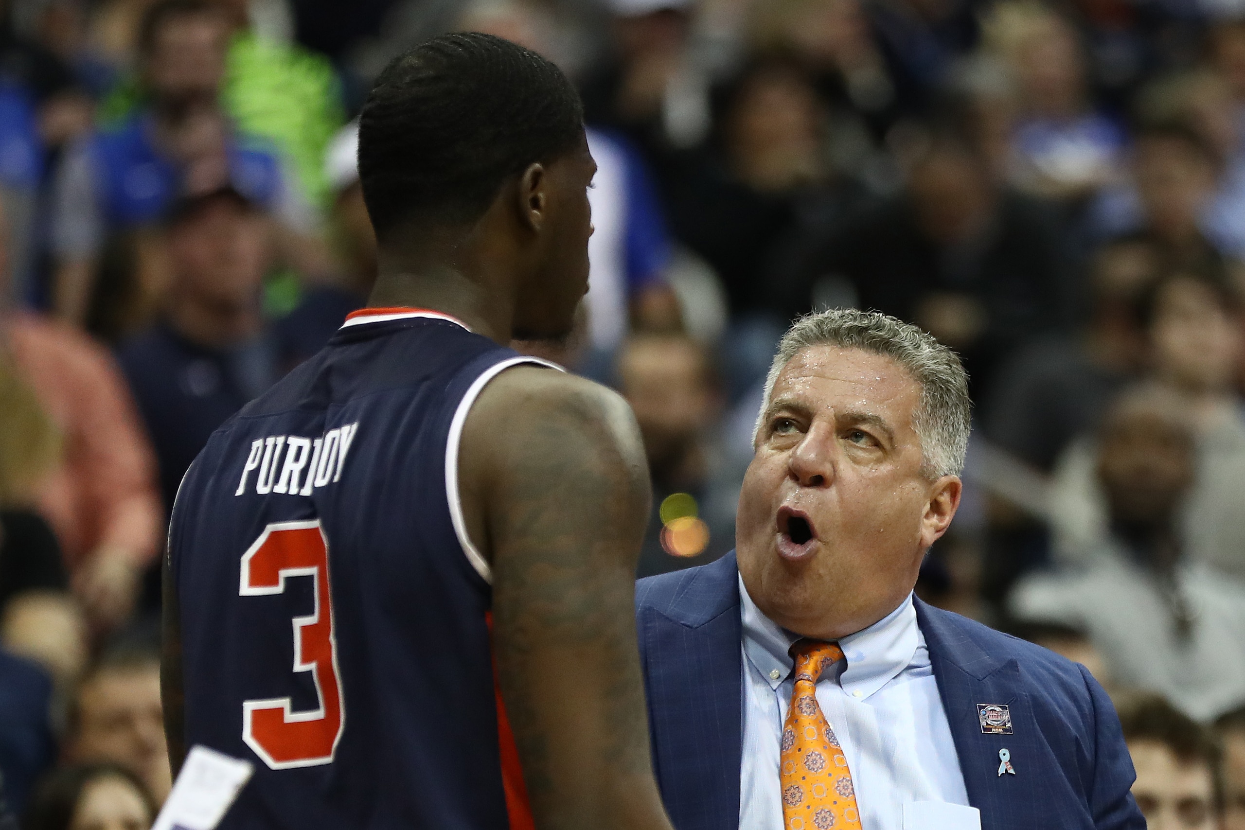 KANSAS CITY, MISSOURI - MARCH 31: Head coach Bruce Pearl of the Auburn Tigers speaks with Danjel Purifoy #3 during their game against the Kentucky Wildcats during the 2019 NCAA Basketball Tournament Midwest Regional at Sprint Center on March 31, 2019 in K