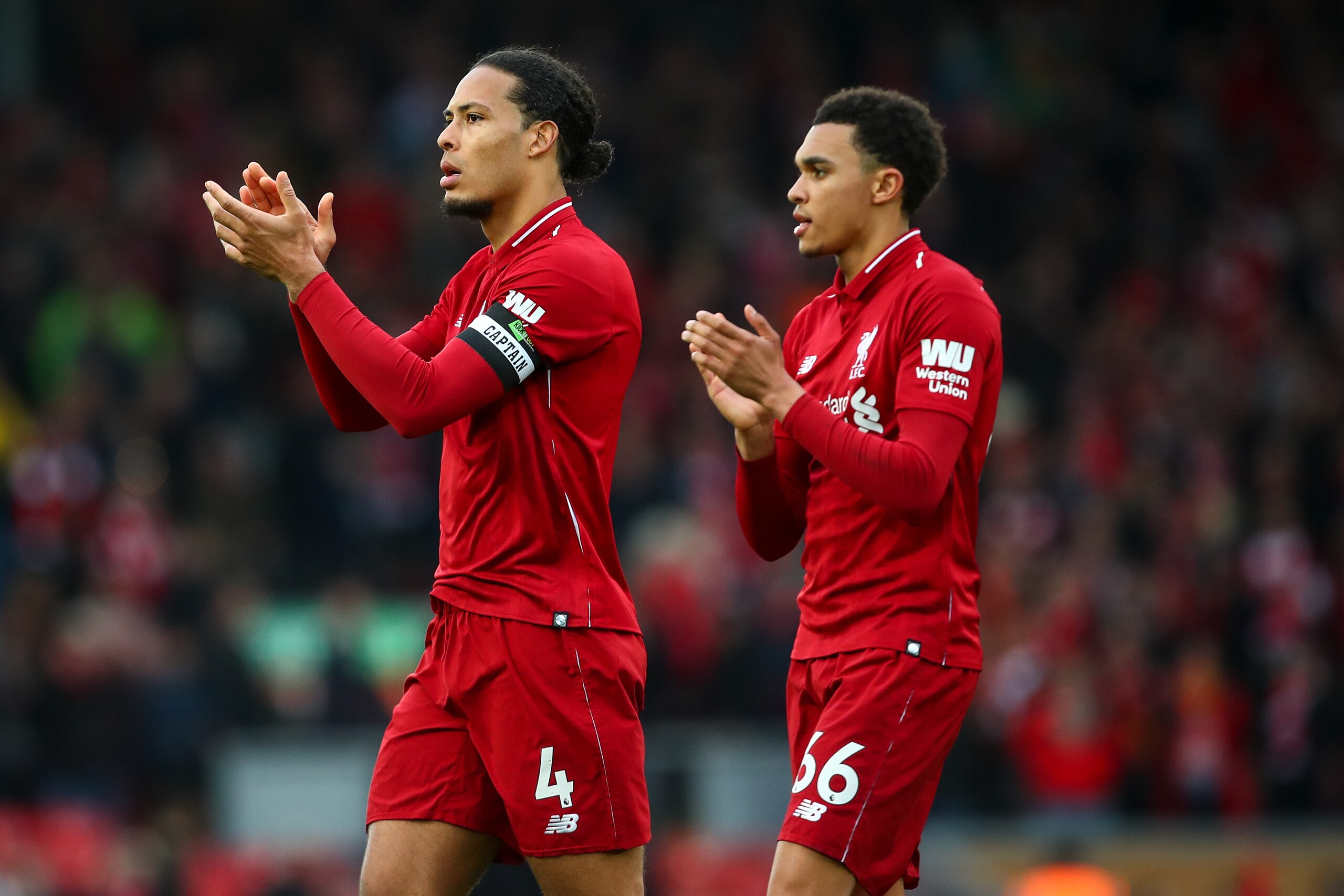 LIVERPOOL, ENGLAND - MARCH 31:  Virgil van Dijk of Liverpool and Trent Alexander-Arnold of Liverpool during the Premier League match between Liverpool FC and Tottenham Hotspur at Anfield on March 31, 2019 in Liverpool, United Kingdom. (Photo by Robbie Jay