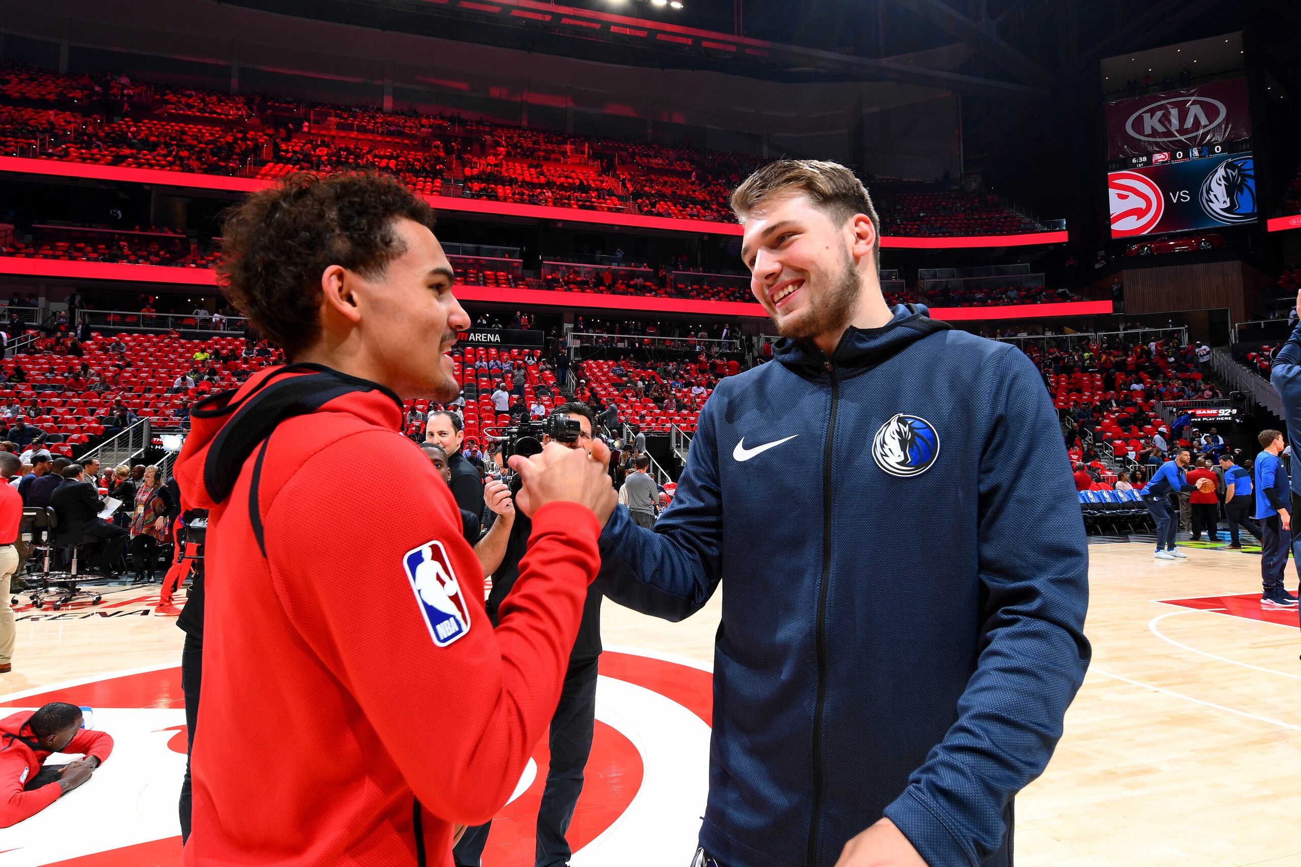 ATLANTA, GA - OCTOBER 24: Trae Young #11 of the Atlanta Hawks and Luka Doncic #77 of the Dallas Mavericks talk before the game on October 24, 2018 at State Farm Arena in Atlanta, Georgia. NOTE TO USER: User expressly acknowledges and agrees that, by downl