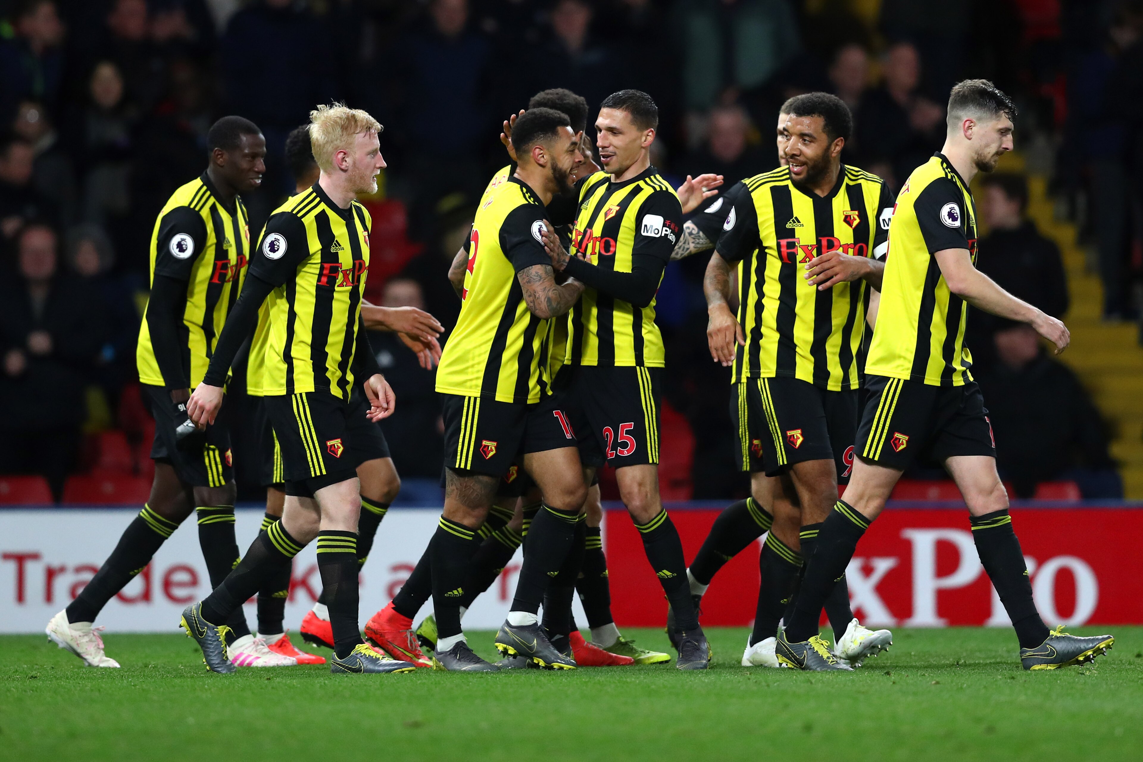 WATFORD, ENGLAND - APRIL 02:  Troy Deeney of Watford celebrates with teammates after scoring his team's third goal during the Premier League match between Watford FC and Fulham FC at Vicarage Road on April 02, 2019 in Watford, United Kingdom. (Photo by Da