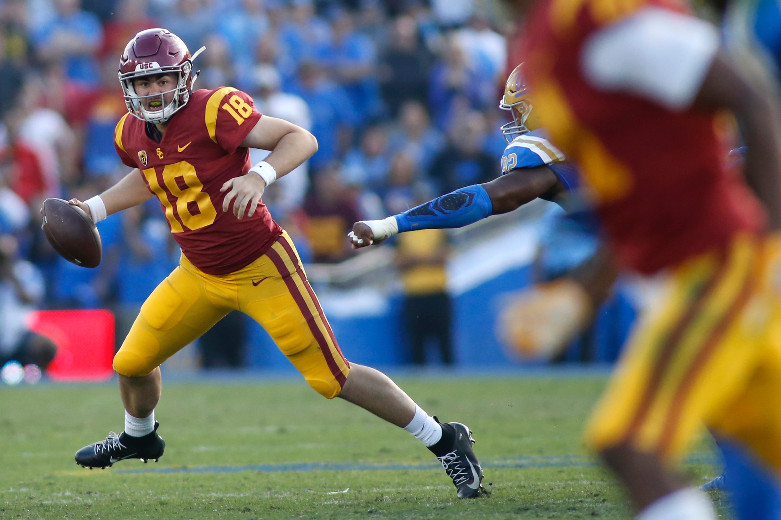 PASADENA, CALIFORNIA - NOVEMBER 17: Quarterback JT Daniels #18 of the USC Trojans looks for an opening during the second half of a football game at Rose Bowl on November 17, 2018 in Pasadena, California. (Photo by Katharine Lotze/Getty Images) PASADENA, CALIFORNIA - NOVEMBER 17: Quarterback JT Daniels #18 of the USC Trojans looks for an opening during the second half of a football game at Rose Bowl on November 17, 2018 in Pasadena, California. (Photo by Katharine Lotze/Getty Images)