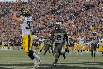 WEST LAFAYETTE, IN - NOVEMBER 03: T.J. Hockenson #38 of the Iowa Hawkeyes catches a touchdown pass in the end zone as Kenneth Major #2 of the Purdue Boilermakers defends at Ross-Ade Stadium on November 3, 2018 in West Lafayette, Indiana. (Photo by Michael