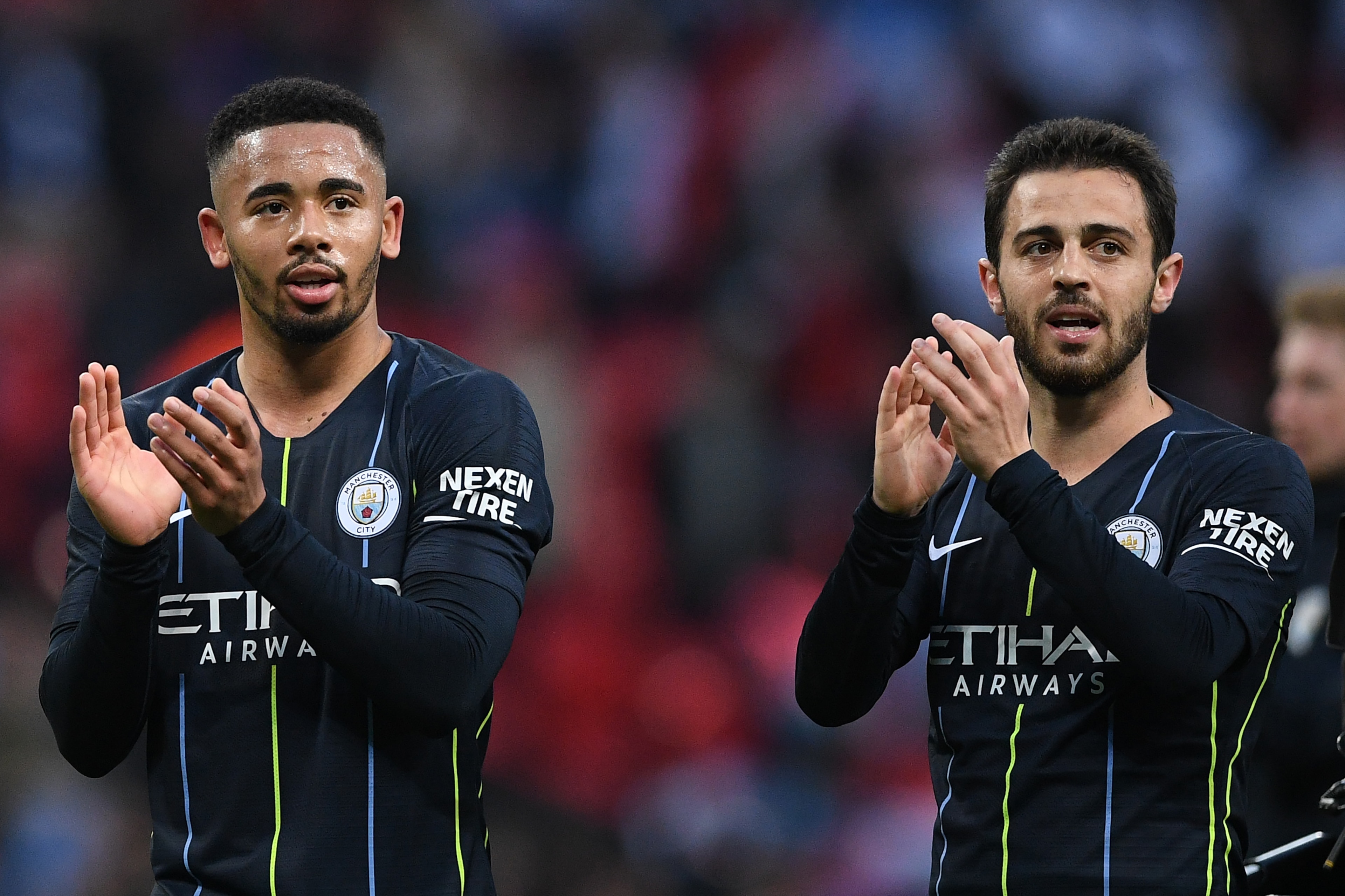 Manchester City's Brazilian striker Gabriel Jesus (L) and Brighton's Brazilian midfielder Bernardo gesture at the final whistle during the English FA Cup semi-final football match between Manchester City and Brighton and Hove Albion at Wembley Stadium in 