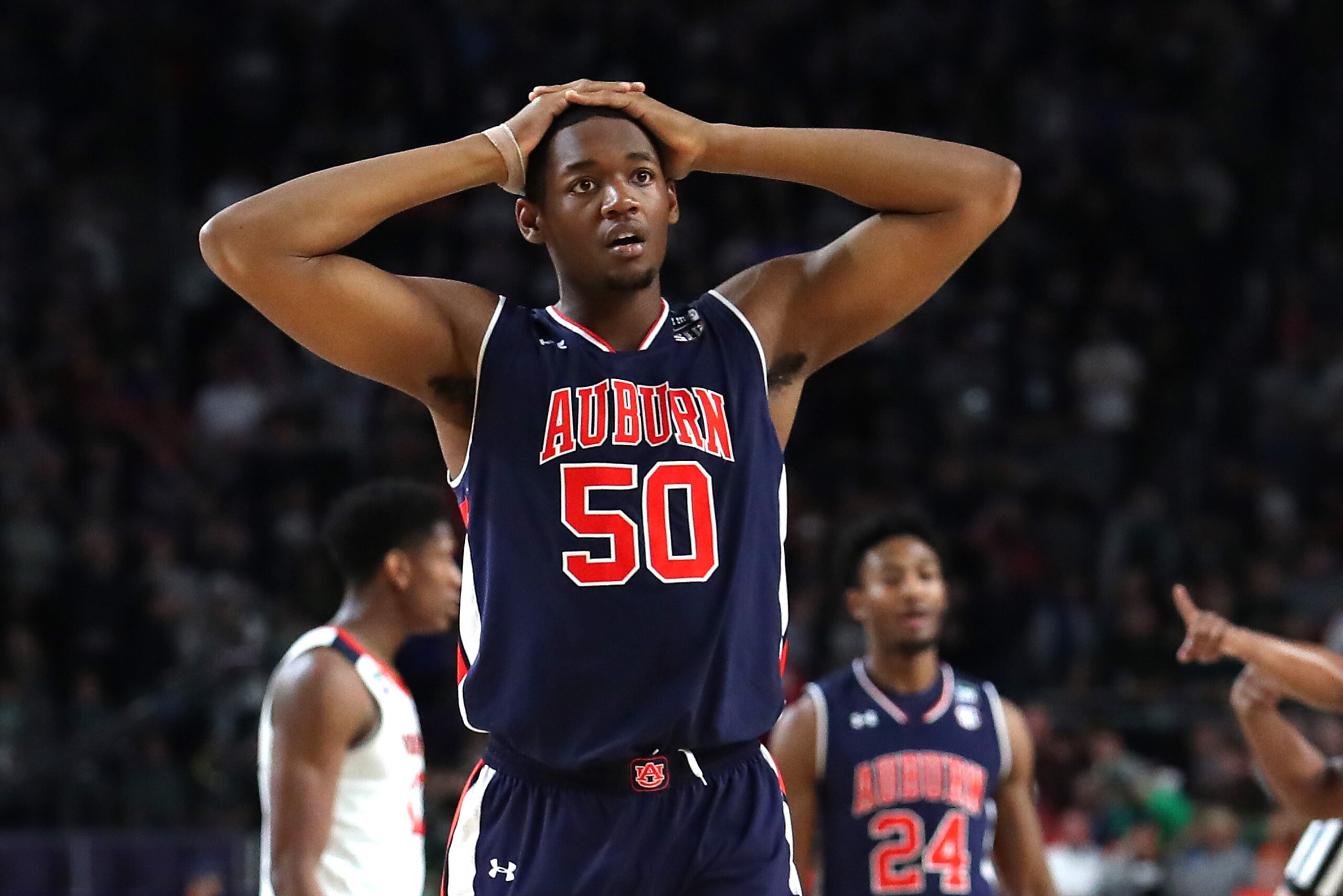 MINNEAPOLIS, MINNESOTA - APRIL 06: Austin Wiley #50 of the Auburn Tigers reacts in the second half against the Virginia Cavaliers during the 2019 NCAA Final Four semifinal at U.S. Bank Stadium on April 6, 2019 in Minneapolis, Minnesota. (Photo by Tom Penn