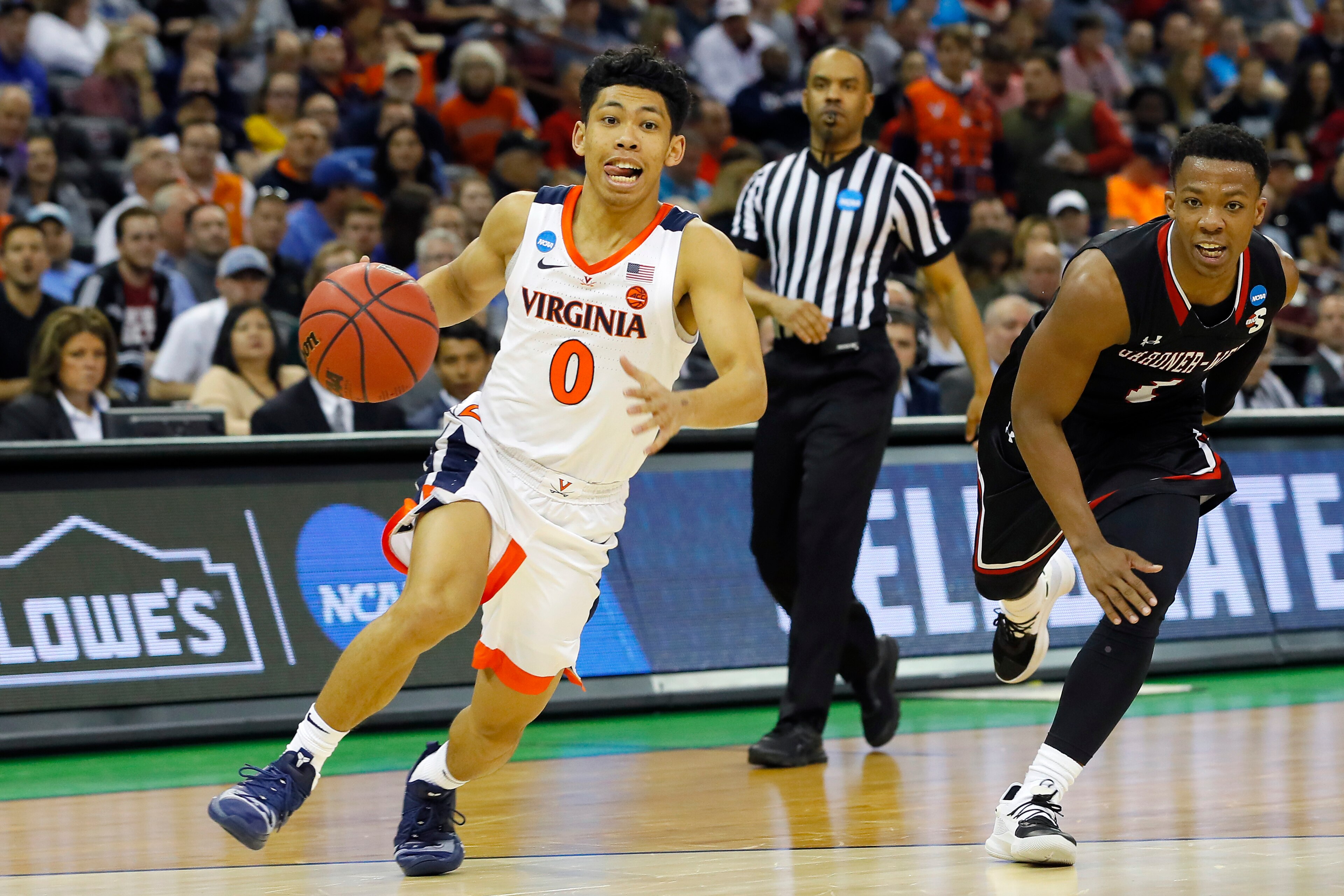 COLUMBIA, SOUTH CAROLINA - MARCH 22: Kihei Clark #0 of the Virginia Cavaliers handles the ball against  Jaheam Cornwall #1 of the Gardner Webb Runnin Bulldogs in the second half during the first round of the 2019 NCAA Men's Basketball Tournament at Coloni