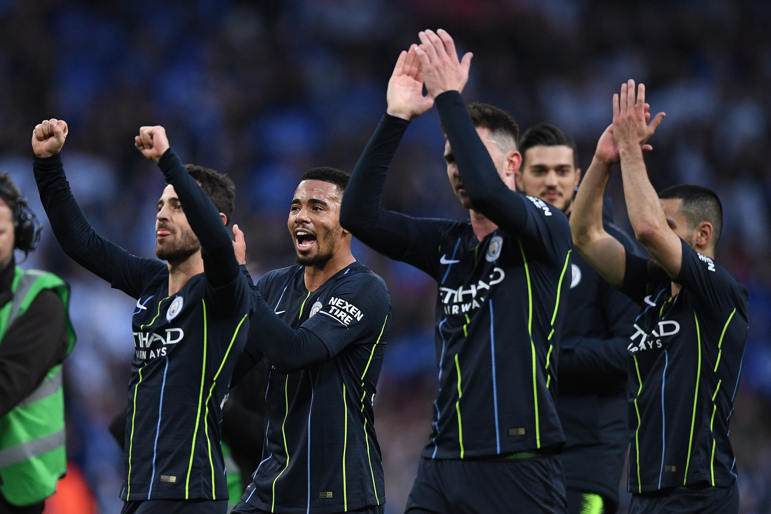 (L-R) Manchester City's Portuguese midfielder Bernardo Silva, Manchester City's Brazilian striker Gabriel Jesus, Manchester City's French defender Aymeric Laporte and Manchester City's German midfielder Ilkay Gundogan  gesture at the final whistle during 