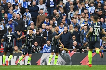 Manchester City's Brazilian striker Gabriel Jesus (2R) celebrates after scoring the team's first goal during the English FA Cup semi-final football match between Manchester City and Brighton and Hove Albion at Wembley Stadium in London, on April 6, 2019. 