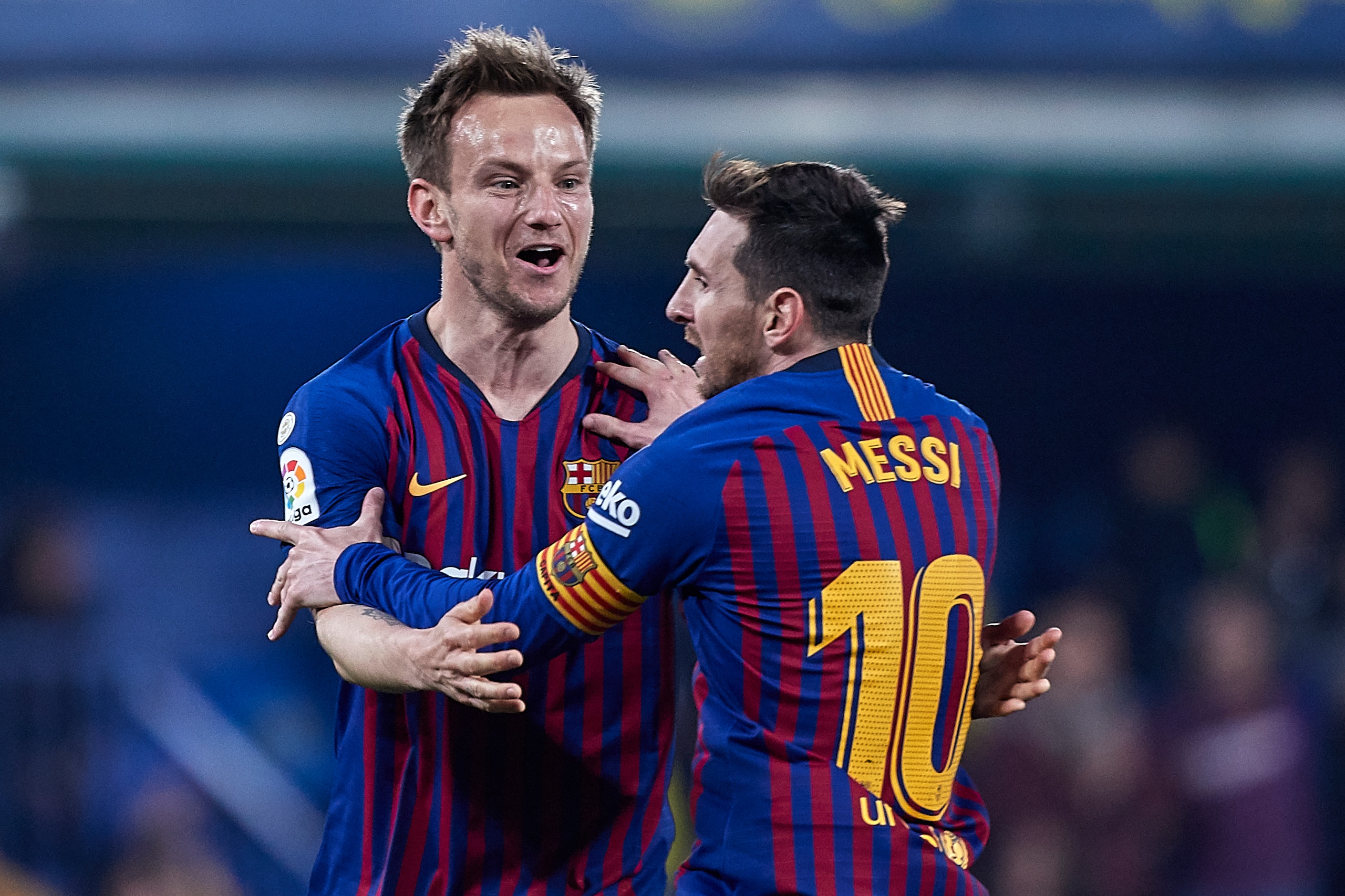 VILLAREAL, SPAIN - APRIL 02:  Lionel Messi of FC Barcelona celebrates with Ivan Rakitic of FC Barcelona his team's fourth goal scored by Luis Suarez of FC Barcelona during the La Liga match between Villarreal CF and FC Barcelona at Estadio de la Ceramica 