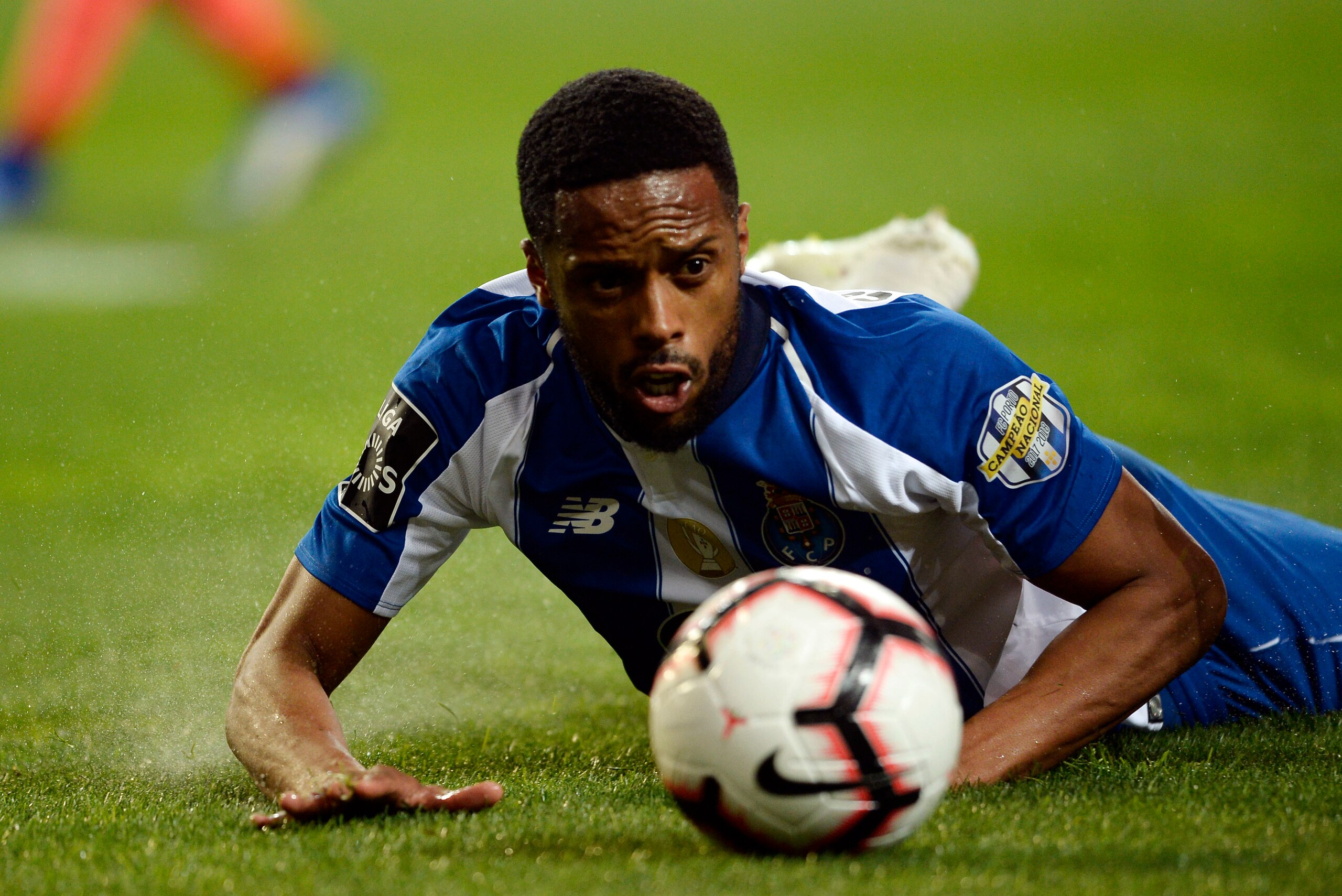 Porto's Portuguese forward Hernani Fortes lies on the ground during the Portuguese league football match between FC Porto and Boavista FC at the Dragao stadium in Porto on April 5, 2019. (Photo by MIGUEL RIOPA / AFP)        (Photo credit should read MIGUE