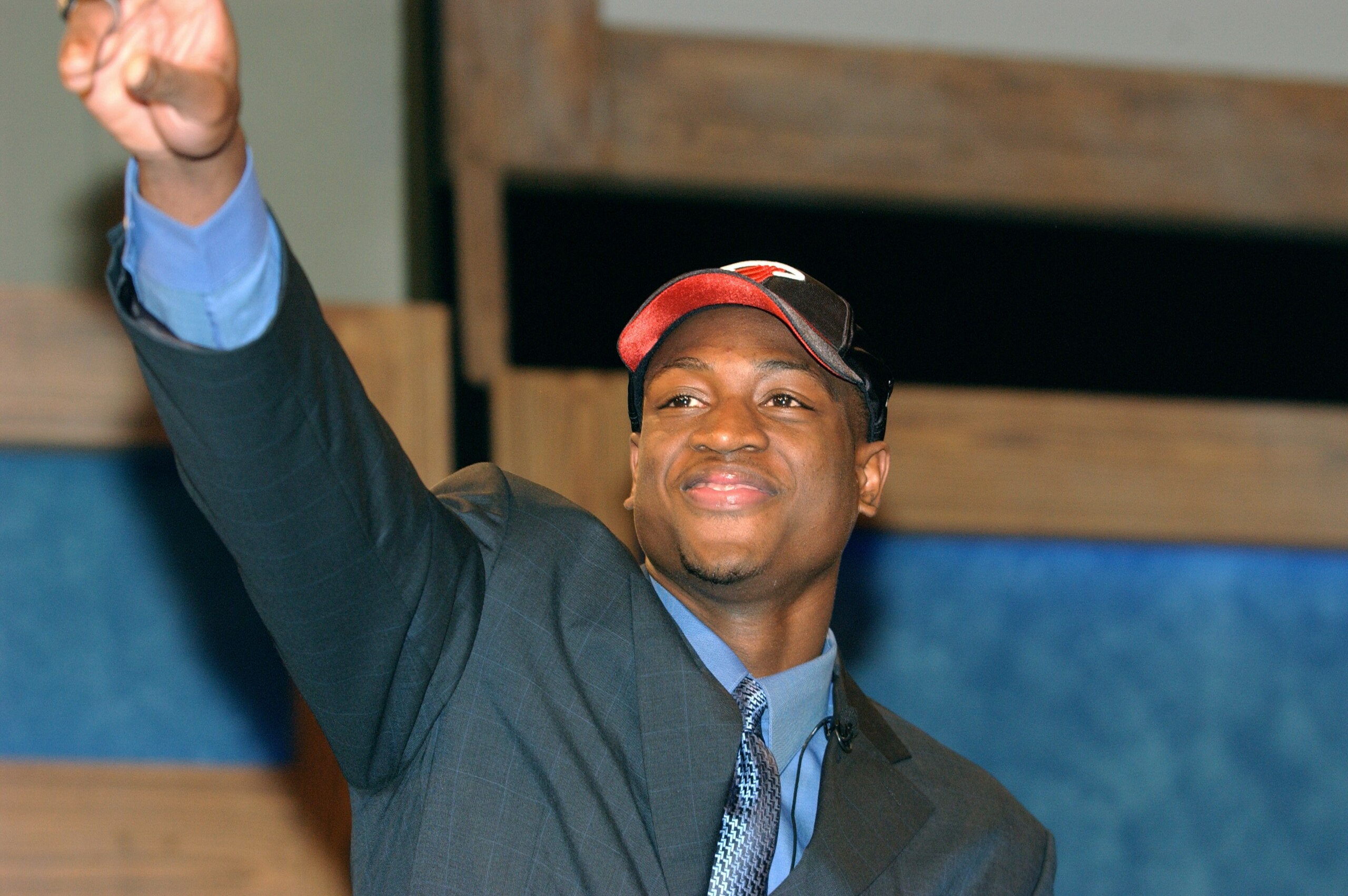 NEW YORK - JUNE 26:  Dwyane Wade who was selected by the Miami Heat waves to the crowd during the 2003 NBA Draft at the Paramount Theatre at Madison Square Garden on June 26, 2003 in New York, New York.  NOTE TO USER: User expressly acknowledges and agree
