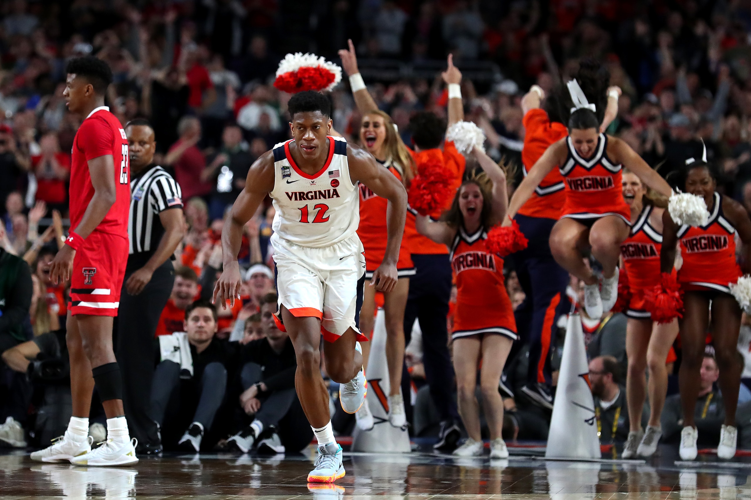 MINNEAPOLIS, MINNESOTA - APRIL 08:  De'Andre Hunter #12 of the Virginia Cavaliers celebrates his three point basket basket late in the second half against the Texas Tech Red Raiders during the 2019 NCAA men's Final Four National Championship game at U.S. 