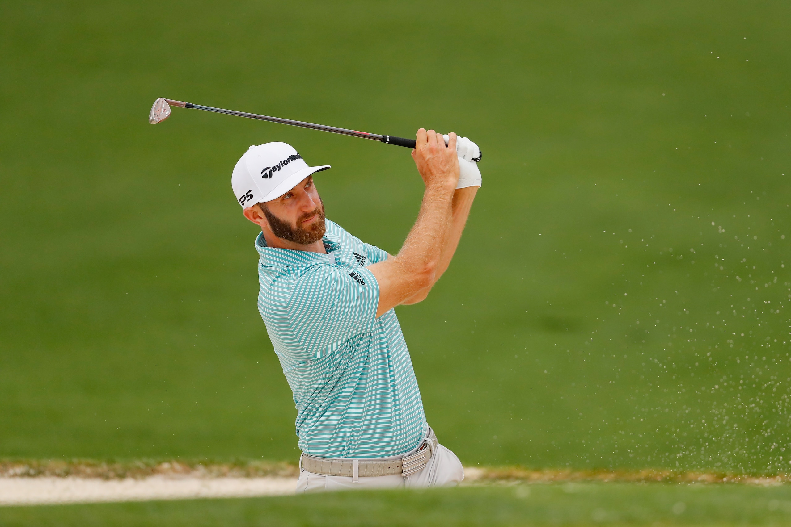 AUGUSTA, GEORGIA - APRIL 08:  Dustin Johnson of the United States plays a shot from a bunker during a practice round prior to The Masters at Augusta National Golf Club on April 08, 2019 in Augusta, Georgia. (Photo by Kevin C. Cox/Getty Images)