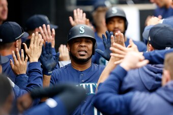 CHICAGO, ILLINOIS - APRIL 07: Edwin Encarnacion #10 of the Seattle Mariners celebrates in the dugout after hitting a two run home run in the fourth inning against the against the Chicago White Sox at Guaranteed Rate Field on April 07, 2019 in Chicago, Ill