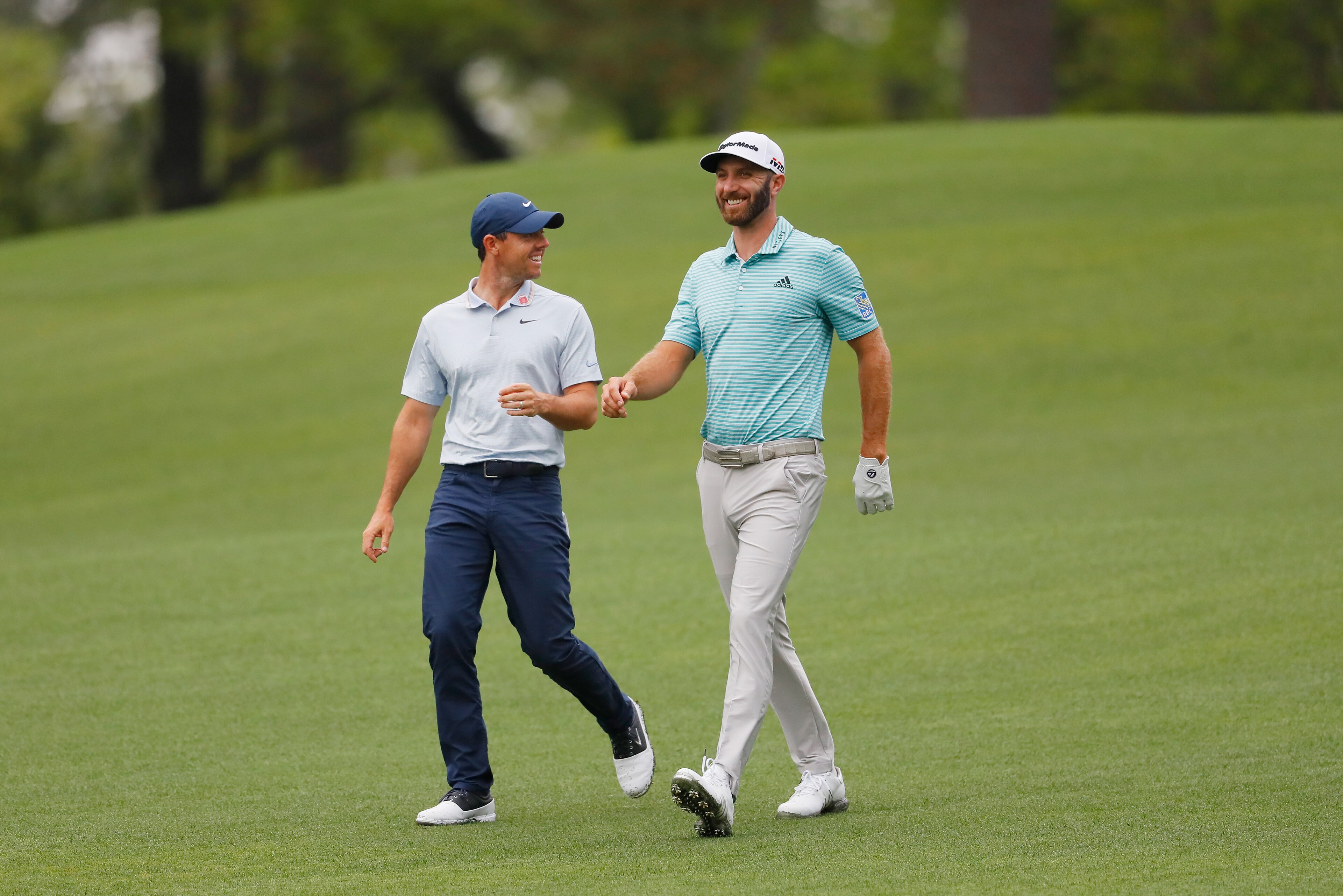 AUGUSTA, GEORGIA - APRIL 08:  Rory McIlroy of Northern Ireland and Dustin Johnson of the United States walk on the second hole during a practice round prior to The Masters at Augusta National Golf Club on April 08, 2019 in Augusta, Georgia. (Photo by Kevi