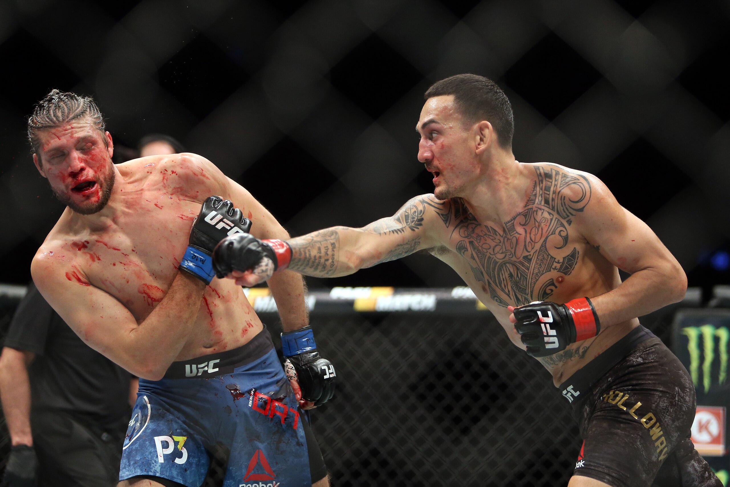 TORONTO, ON - DECEMBER 8: Max Holloway of the United States fights against Brian Ortega (L) of the United States in a featherweight bout during the UFC 231 event at Scotiabank Arena on December 8, 2018 in Toronto, Canada. (Photo by Vaughn Ridley/Getty I TORONTO, ON - DECEMBER 8: Max Holloway of the United States fights against Brian Ortega (L) of the United States in a featherweight bout during the UFC 231 event at Scotiabank Arena on December 8, 2018 in Toronto, Canada. (Photo by Vaughn Ridley/Getty I