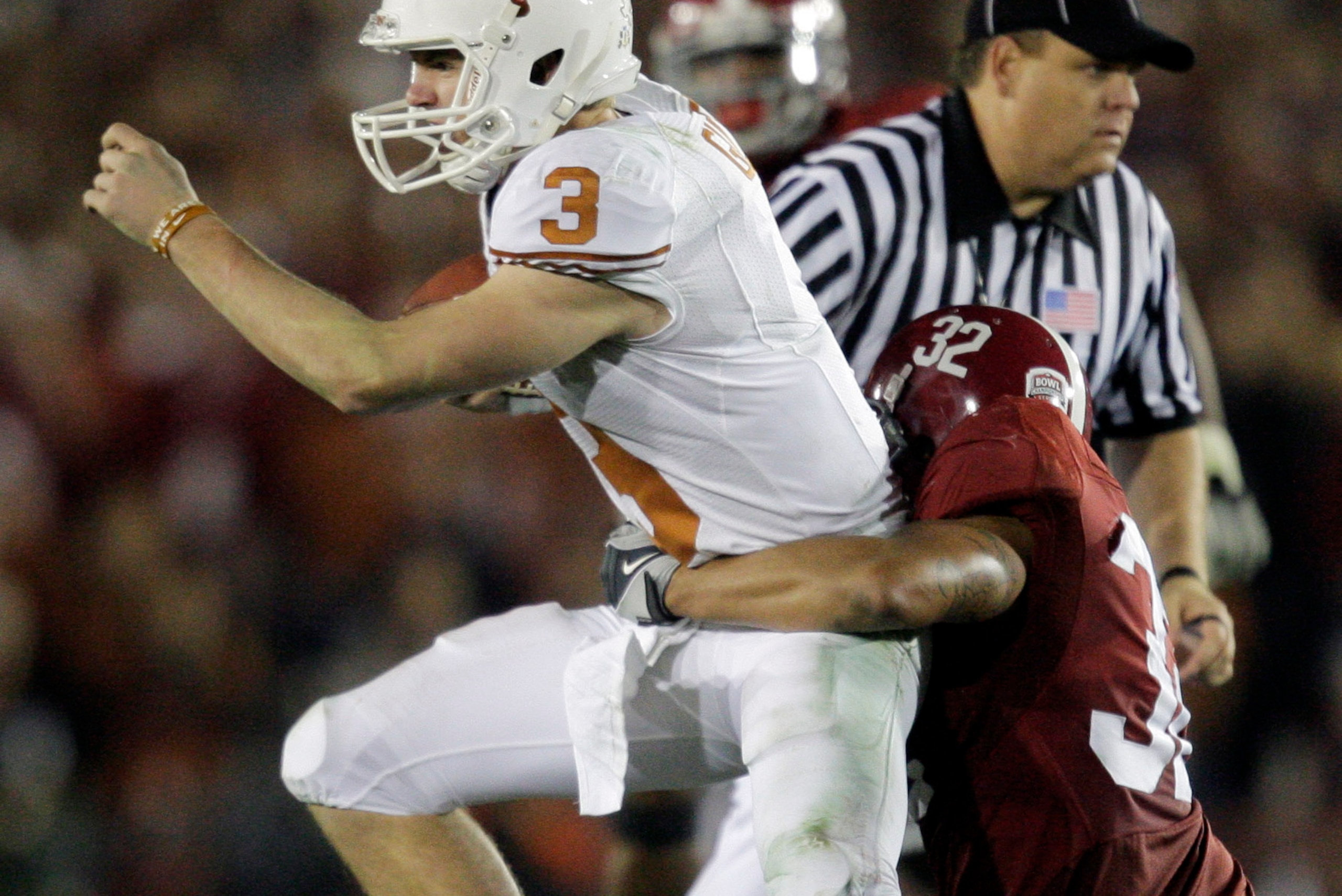 Anders (right) gets a game-sealing sack on Texas quarterback Colt McCory.