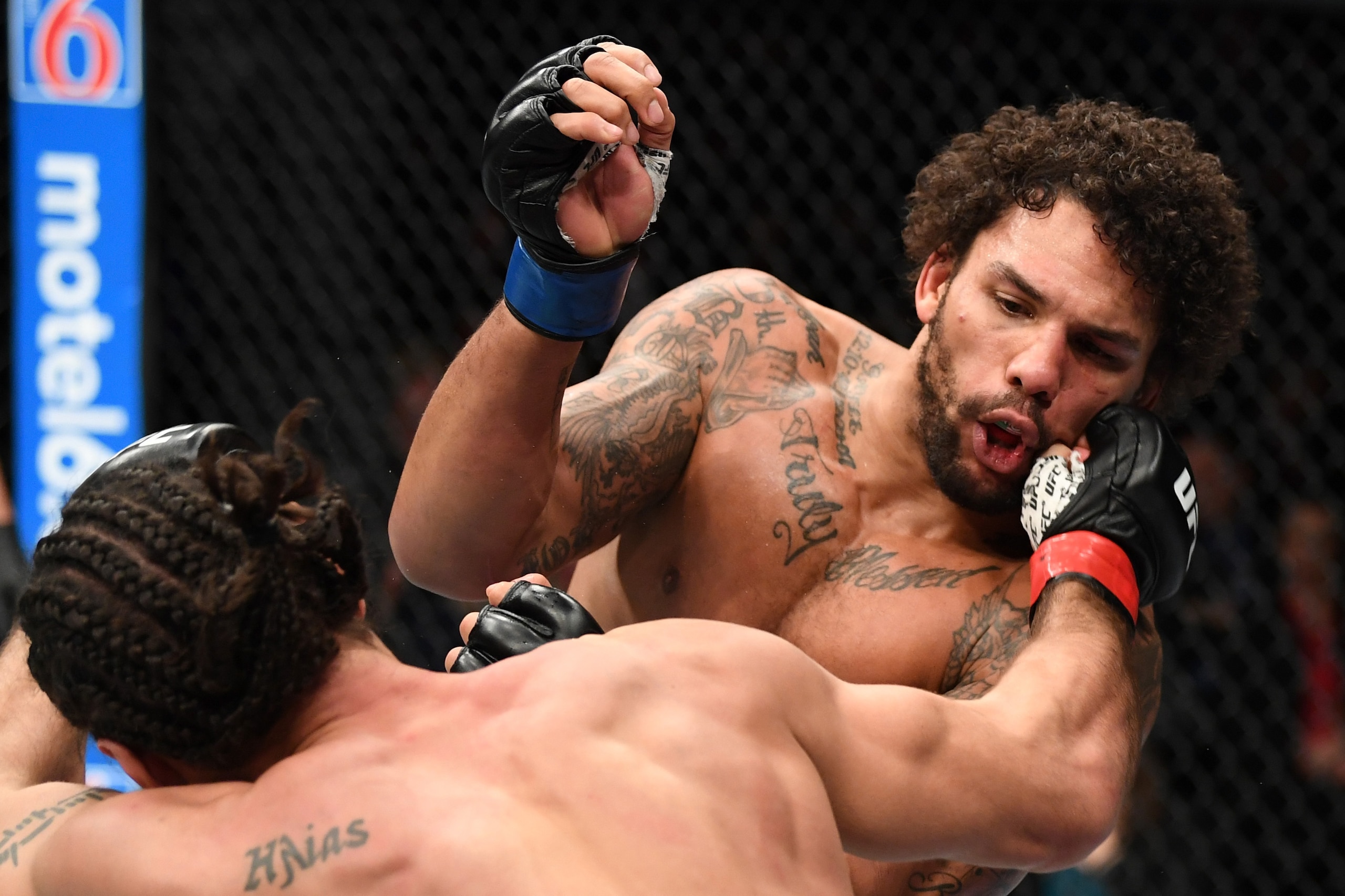TORONTO, CANADA - DECEMBER 08:  (L-R) Elias Theodorou of Canada punches Eryk Anders in their middleweight fight during the UFC 231 event at Scotiabank Arena on December 8, 2018 in Toronto, Canada. (Photo by Josh Hedges/Zuffa LLC/Zuffa LLC via Getty Images