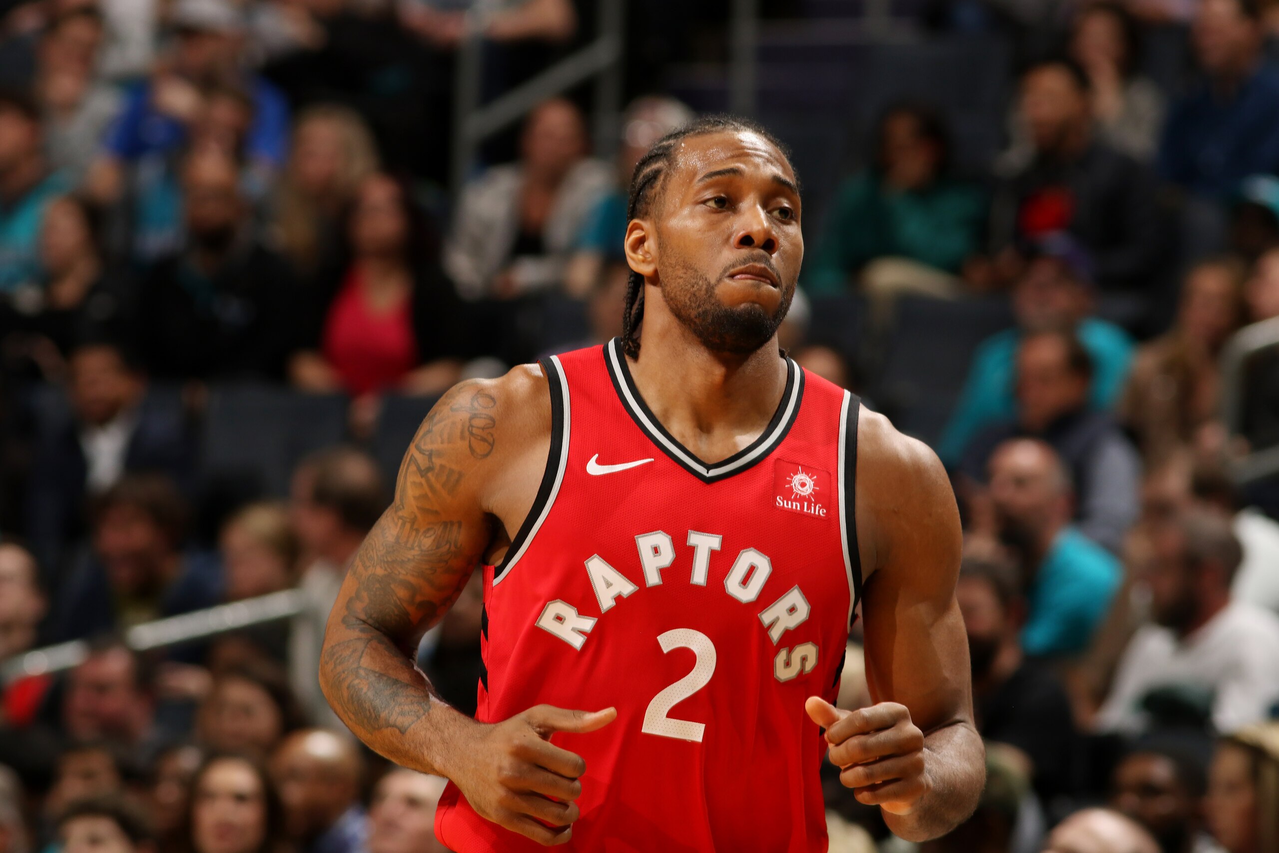 CHARLOTTE, NC - APRIL 5: Kawhi Leonard #2 of the Toronto Raptors looks on during the game against the Charlotte Hornets on April 5, 2019 at Spectrum Center in Charlotte, North Carolina. NOTE TO USER: User expressly acknowledges and agrees that, by downloa