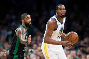 BOSTON, MA - JANUARY 26:  Kyrie Irving #11 of the Boston Celtics guards Kevin Durant #35 of the Golden State Warriors during a game at TD Garden on January 26, 2019 in Boston, Massachusetts. NOTE TO USER: User expressly acknowledges and agrees that, by do