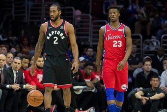 PHILADELPHIA, PA - FEBRUARY 05: Kawhi Leonard #2 of the Toronto Raptors and Jimmy Butler #23 of the Philadelphia 76ers walk up the court at the Wells Fargo Center on February 5, 2019 in Philadelphia, Pennsylvania. The Raptors defeated the 76ers 119-107. N
