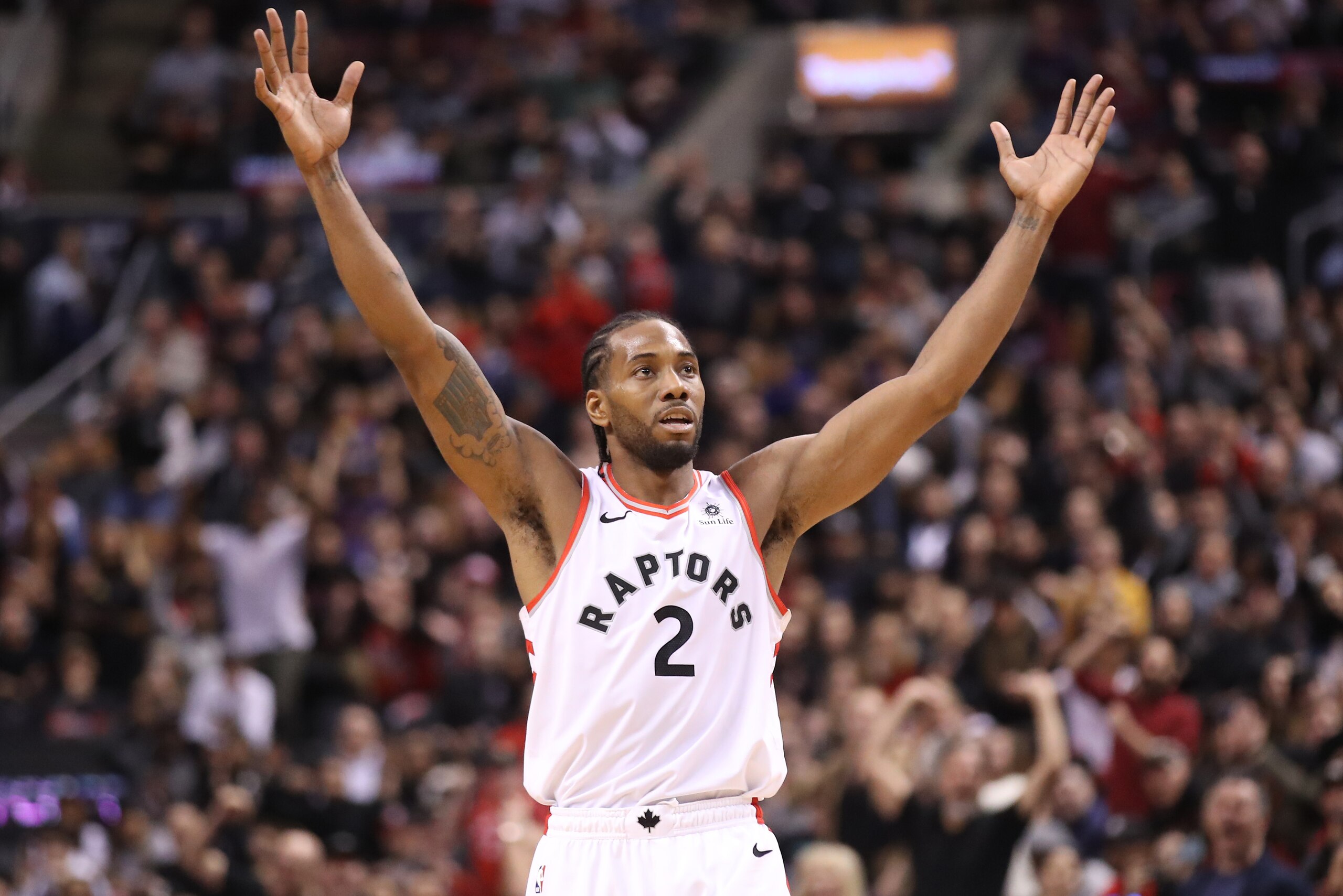TORONTO, ON - APRIL 07: Kawhi Leonard #2 of the Toronto Raptors celebrates a three-pointer scored in overtime by Pascal Siakam #43 against the Miami Heat at Scotiabank Arena on April 7, 2019 in Toronto, Canada. NOTE TO USER: User expressly acknowledges an