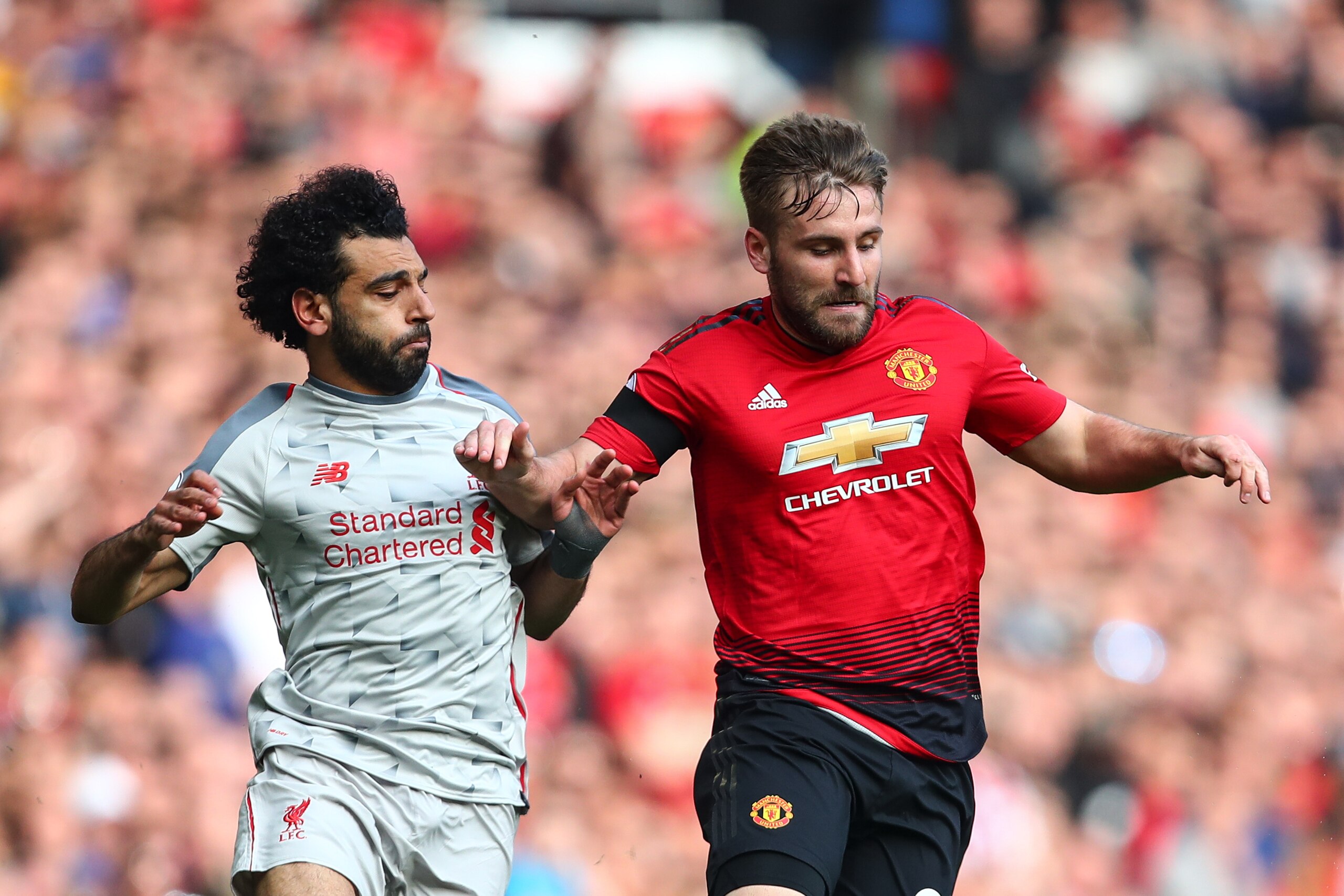 MANCHESTER, ENGLAND - FEBRUARY 24: Mohamed Salah of Liverpool and Luke Shaw of Manchester United during the Premier League match between Manchester United and Liverpool FC at Old Trafford on February 24, 2019 in Manchester, United Kingdom. (Photo by Robbi MANCHESTER, ENGLAND - FEBRUARY 24: Mohamed Salah of Liverpool and Luke Shaw of Manchester United during the Premier League match between Manchester United and Liverpool FC at Old Trafford on February 24, 2019 in Manchester, United Kingdom. (Photo by Robbi