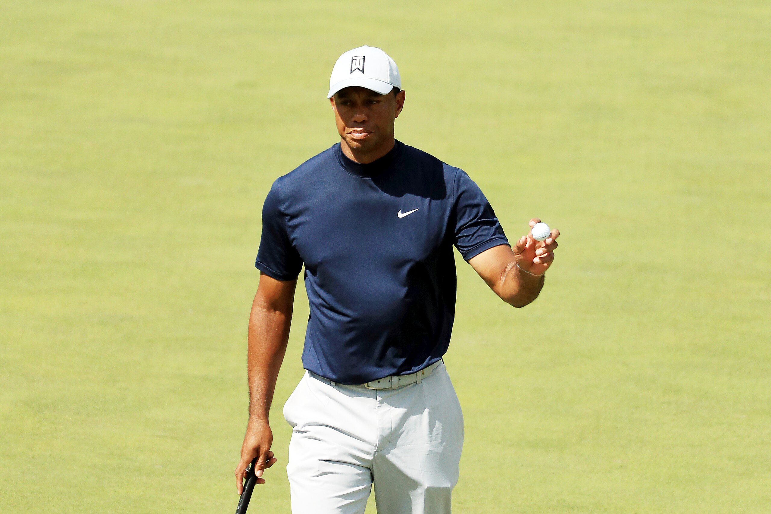 AUGUSTA, GEORGIA - APRIL 11: Tiger Woods of the United States waves on the 16th green during the first round of the Masters at Augusta National Golf Club on April 11, 2019 in Augusta, Georgia. (Photo by Mike Ehrmann/Getty Images)