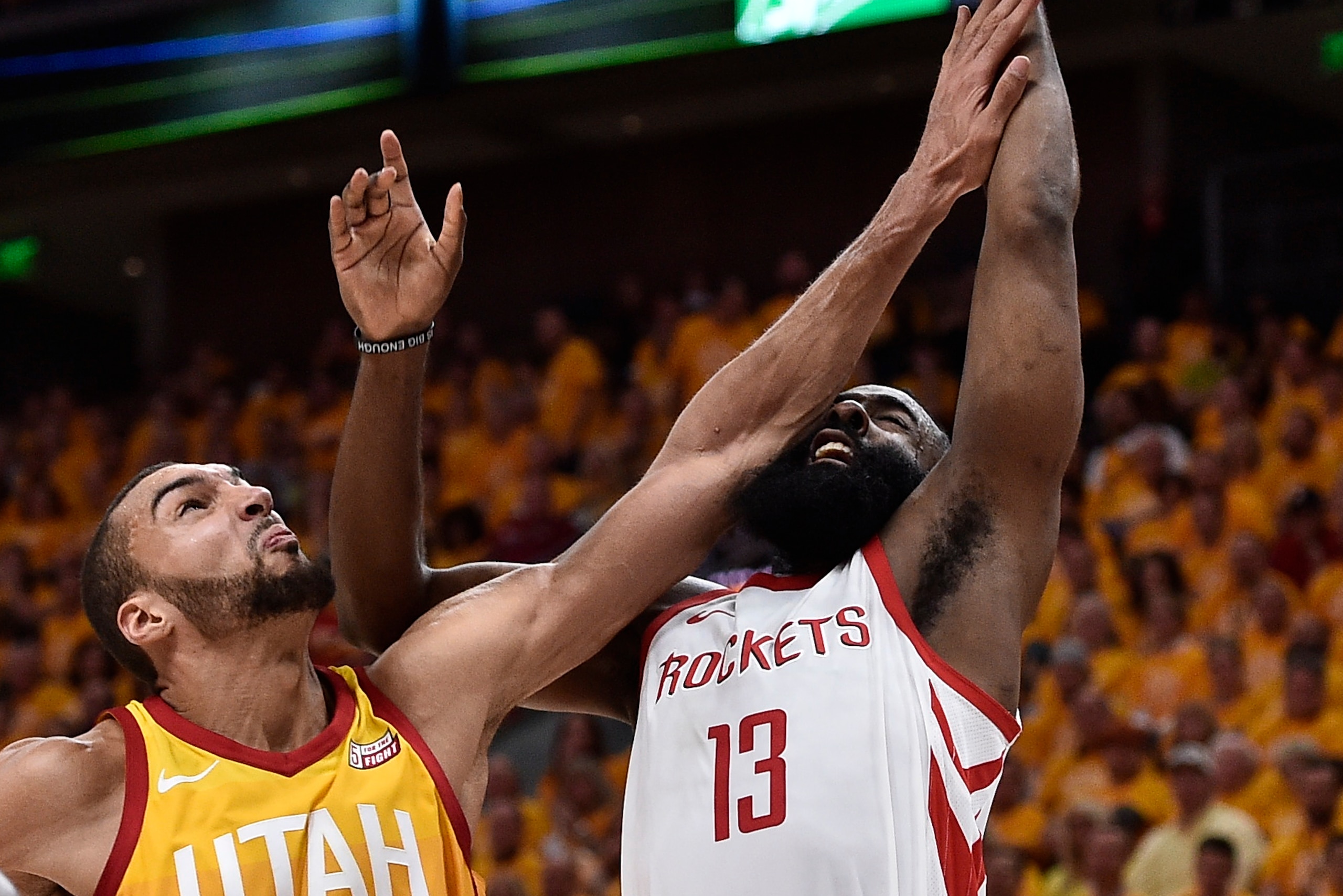 SALT LAKE CITY, UT - MAY 04: Rudy Gobert #27 of the Utah Jazz elbows James Harden #13 of the Houston Rockets under the basket in the second half during Game Three of Round Two of the 2018 NBA Playoffs at Vivint Smart Home Arena on May 4, 2018 in Salt Lake