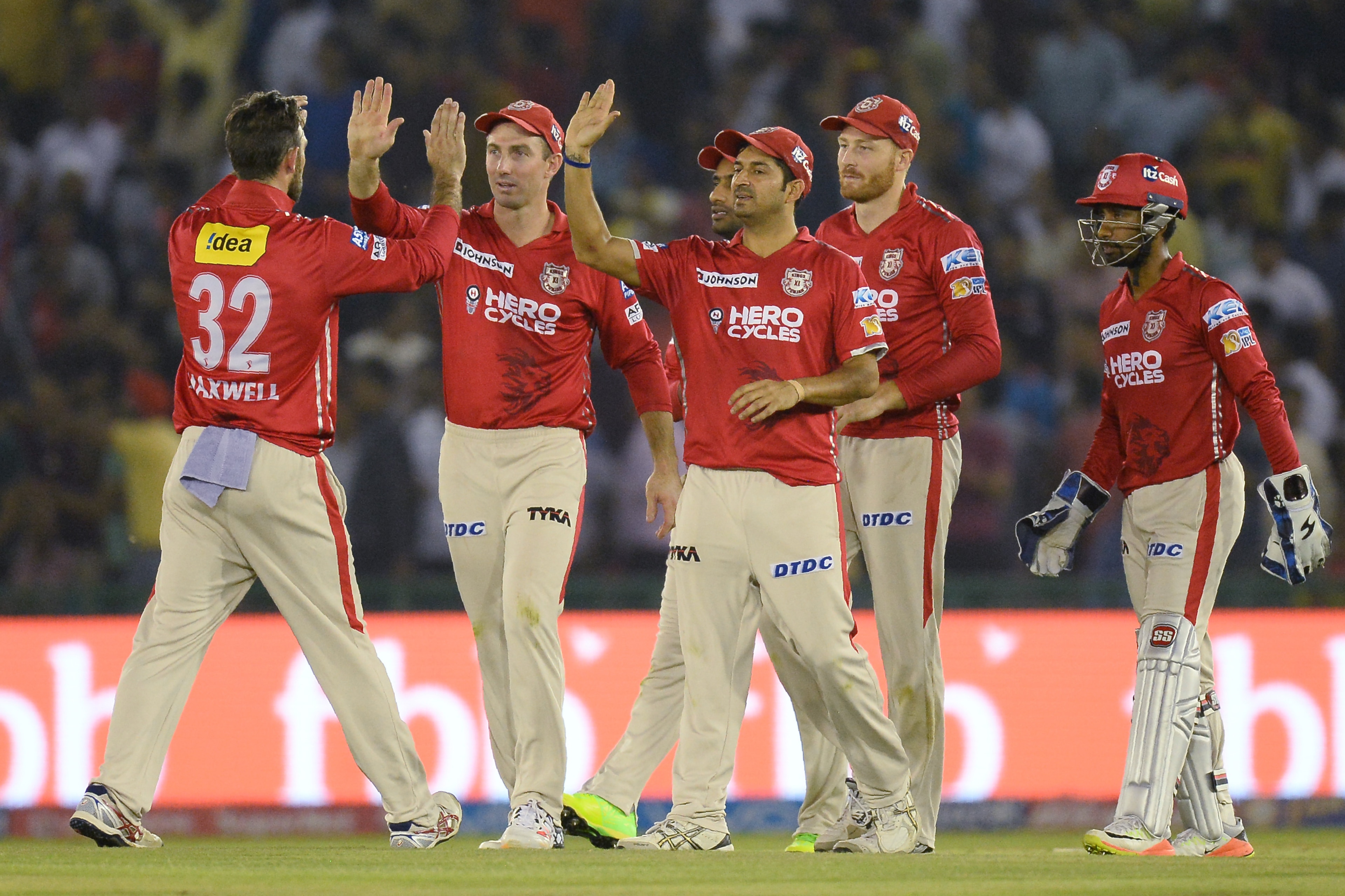 Kings XI Punjab team players celebrates the dismissal of Gujarat Lions batsman Dwayne Smith during the 2017 Indian Premier League (IPL) Twenty20 cricket match between Kings XI Punjab and Gujarat Lions at The Punjab Cricket Association Stadium in Mohali on