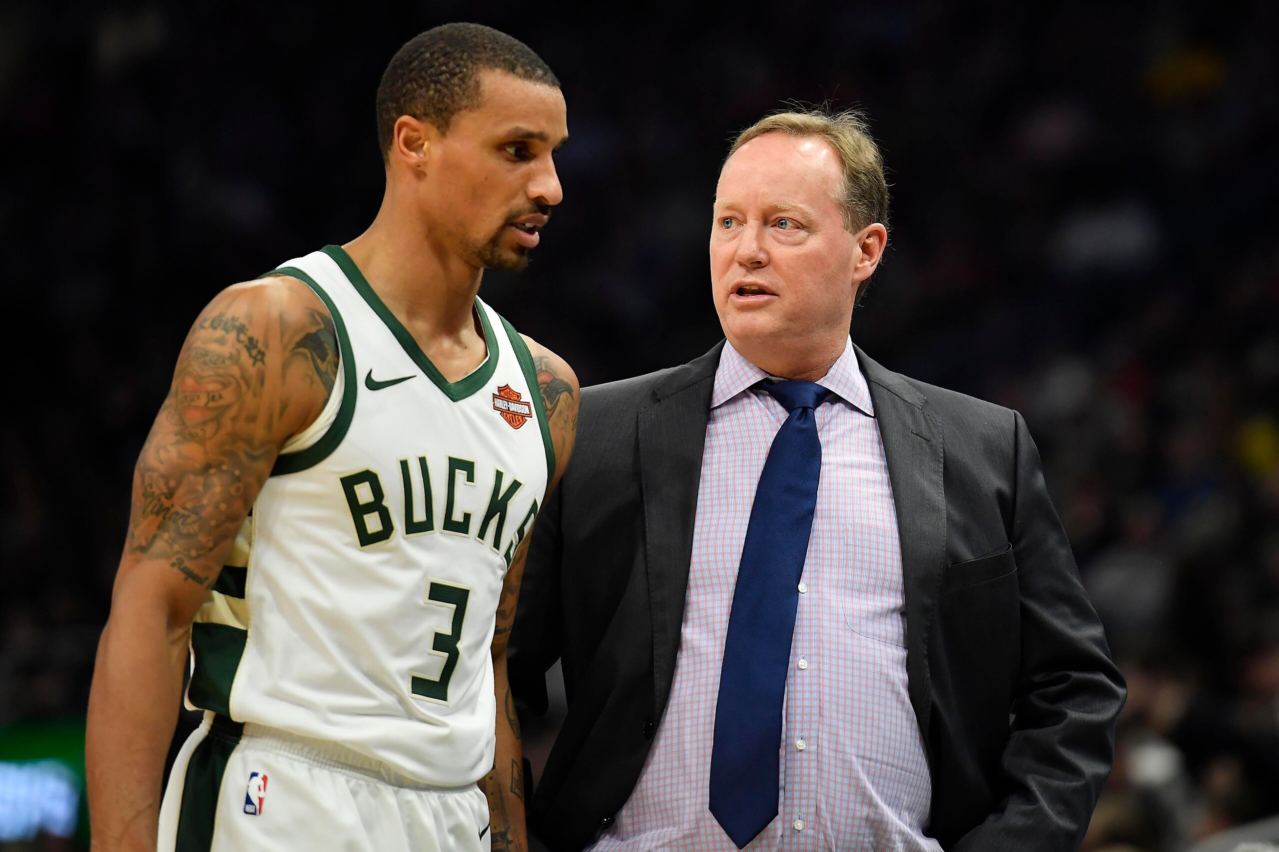 MILWAUKEE, WISCONSIN - APRIL 06:  Mike Budenholzer of the Milwaukee Bucks discusses with George Hill #3 of the Milwaukee Bucks in the first half against the Brooklyn Nets at Fiserv Forum on April 06, 2019 in Milwaukee, Wisconsin.  NOTE TO USER: User expre