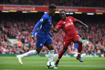 Chelsea's English midfielder Callum Hudson-Odoi (L) vies with Liverpool's Guinean midfielder Naby Keita (R) during the English Premier League football match between Liverpool and Chelsea at Anfield in Liverpool, north west England on April 14, 2019. (Phot