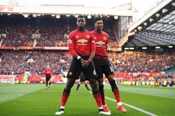 MANCHESTER, ENGLAND - APRIL 13: Paul Pogba of Manchester United celebrates scoring to make it 2-1 with team mate Marcus Rashford during the Premier League match between Manchester United and West Ham United at Old Trafford on April 13, 2019 in Manchester,