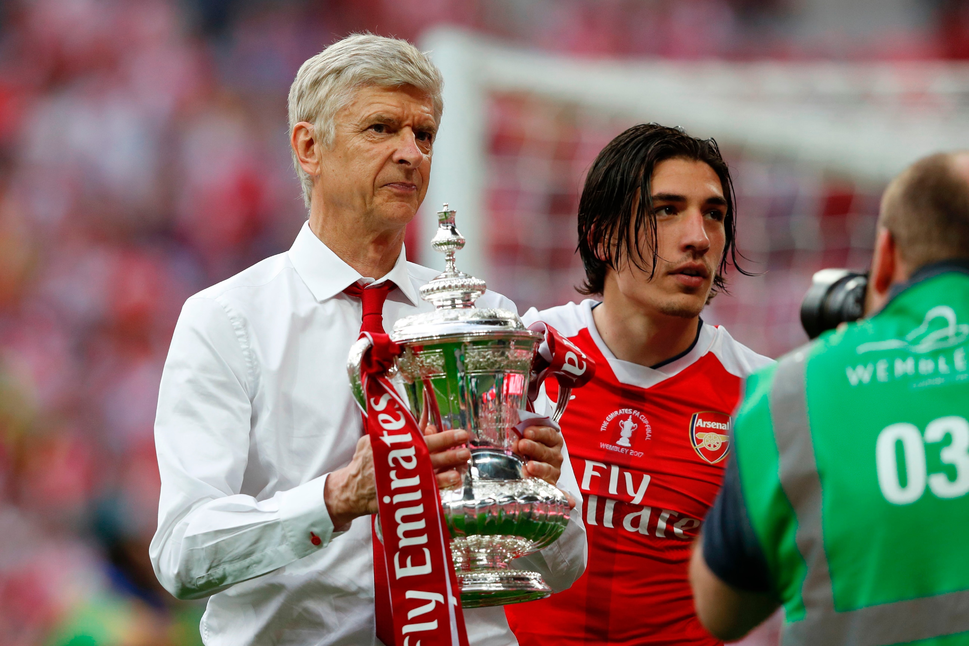 Arsenal's French manager Arsene Wenger holds the FA Cup trophy on the pitch after their win over Chelsea in the English FA Cup final football match between Arsenal and Chelsea at Wembley stadium in London on May 27, 2017.
Aaron Ramsey scored a 79th-minute