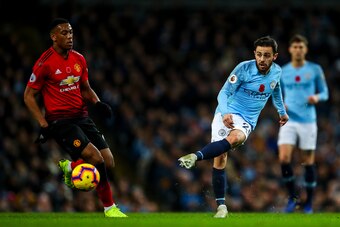 MANCHESTER, ENGLAND - NOVEMBER 11: Bernardo Silva of Manchester City and Anthony Martial of Manchester United during the Premier League match between Manchester City and Manchester United at Etihad Stadium on November 11, 2018 in Manchester, United Kingdo